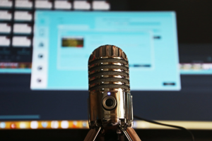 Selective focus shot of a microphone; image by Magda Ehlers, via Pexels.com.