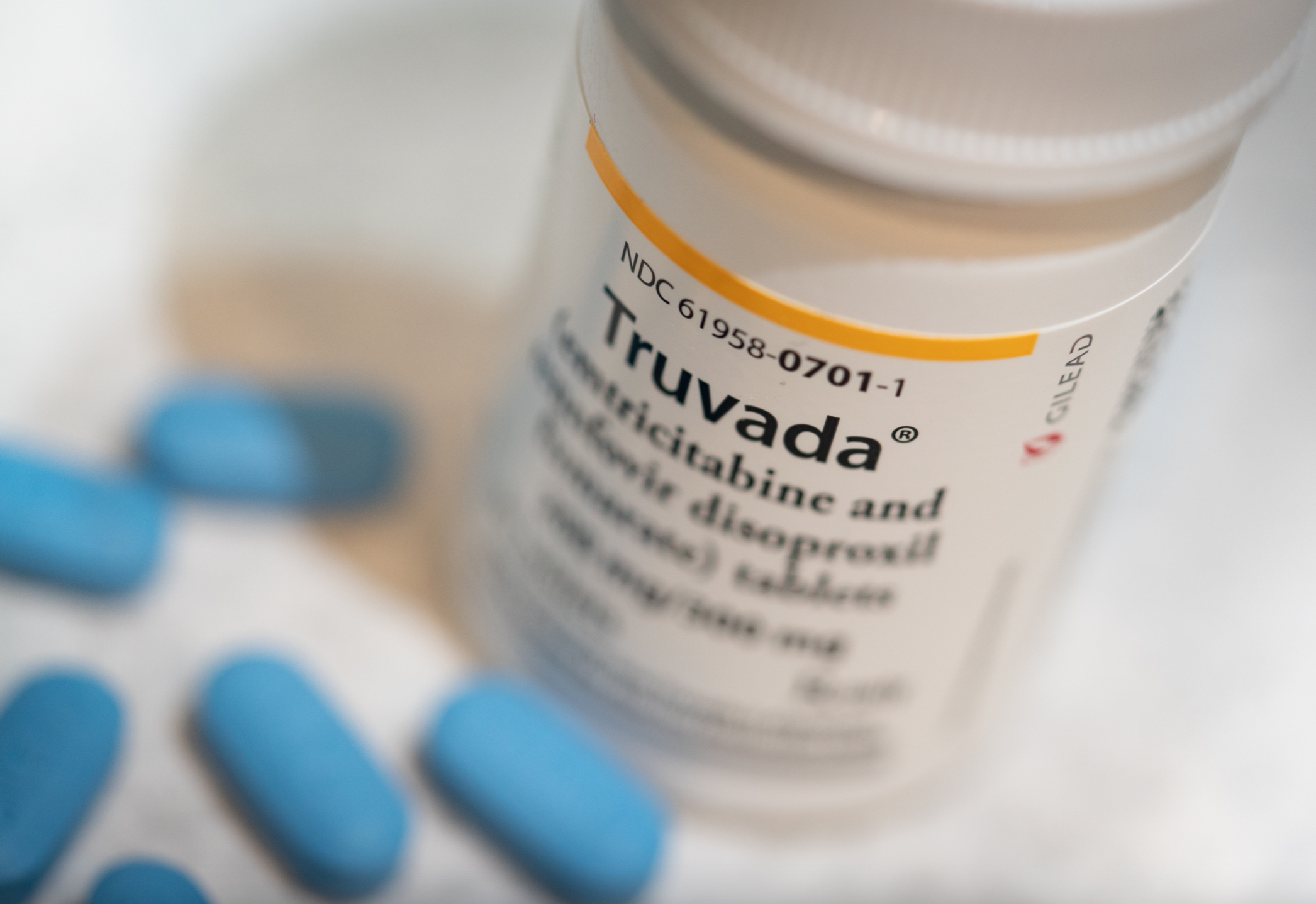 Bottle of Truvada, with pills around it; image by Tony Webster from Minneapolis, Minnesota, United States, CC BY-SA 2.0, no changes made, via Wikimedia Commons.