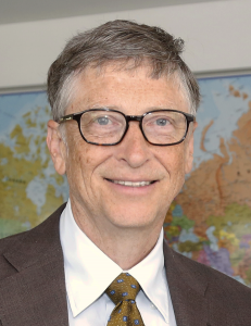 A middle-aged man in glasses and a suit.