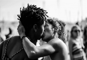 Man and woman kissing; image by Juliette F, via Unsplash.com.