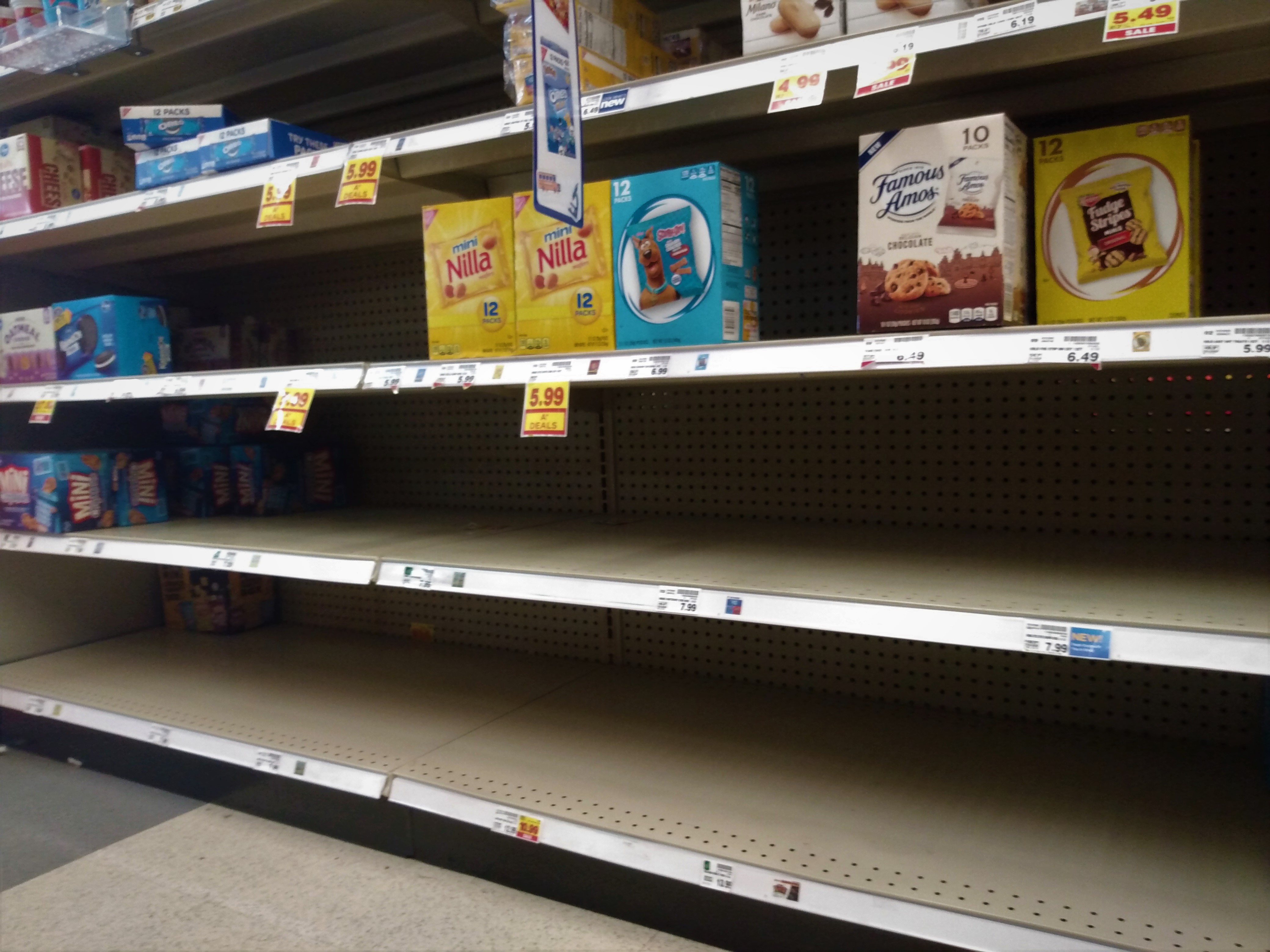 Nearly bare grocery store shelves.