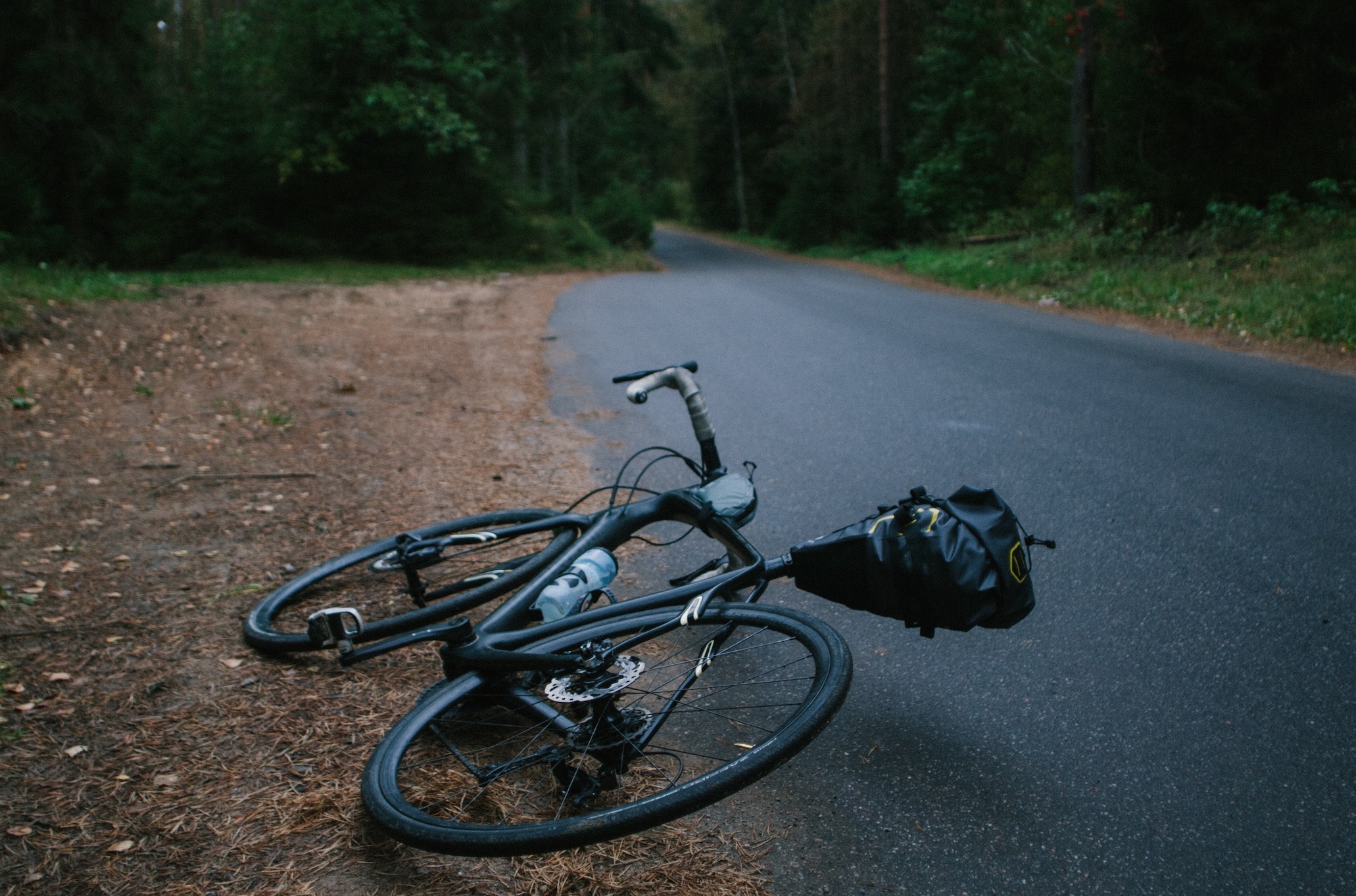 Bike at the side of the road; image by Dmitrii Vaccinium, via Unsplash.com.