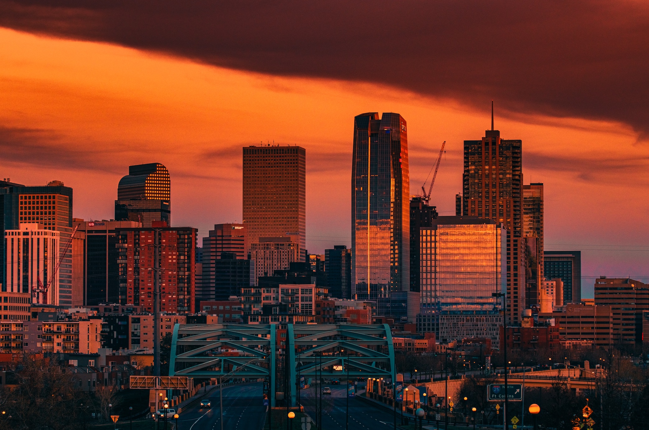 Denver skyline at night; image by Jakob Rosen, via Unsplash.com.