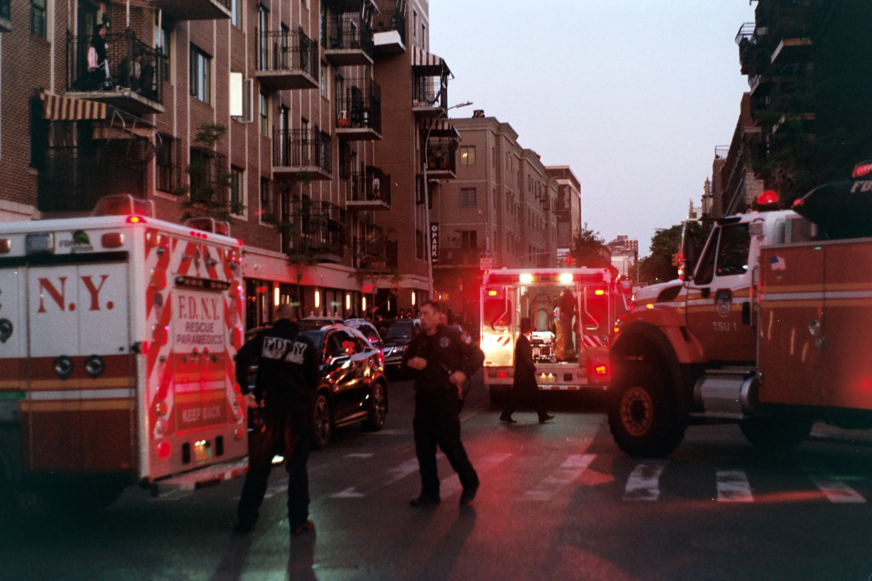 Emergency vehicles on street; image by Nate Isaac, via Unsplash.com.