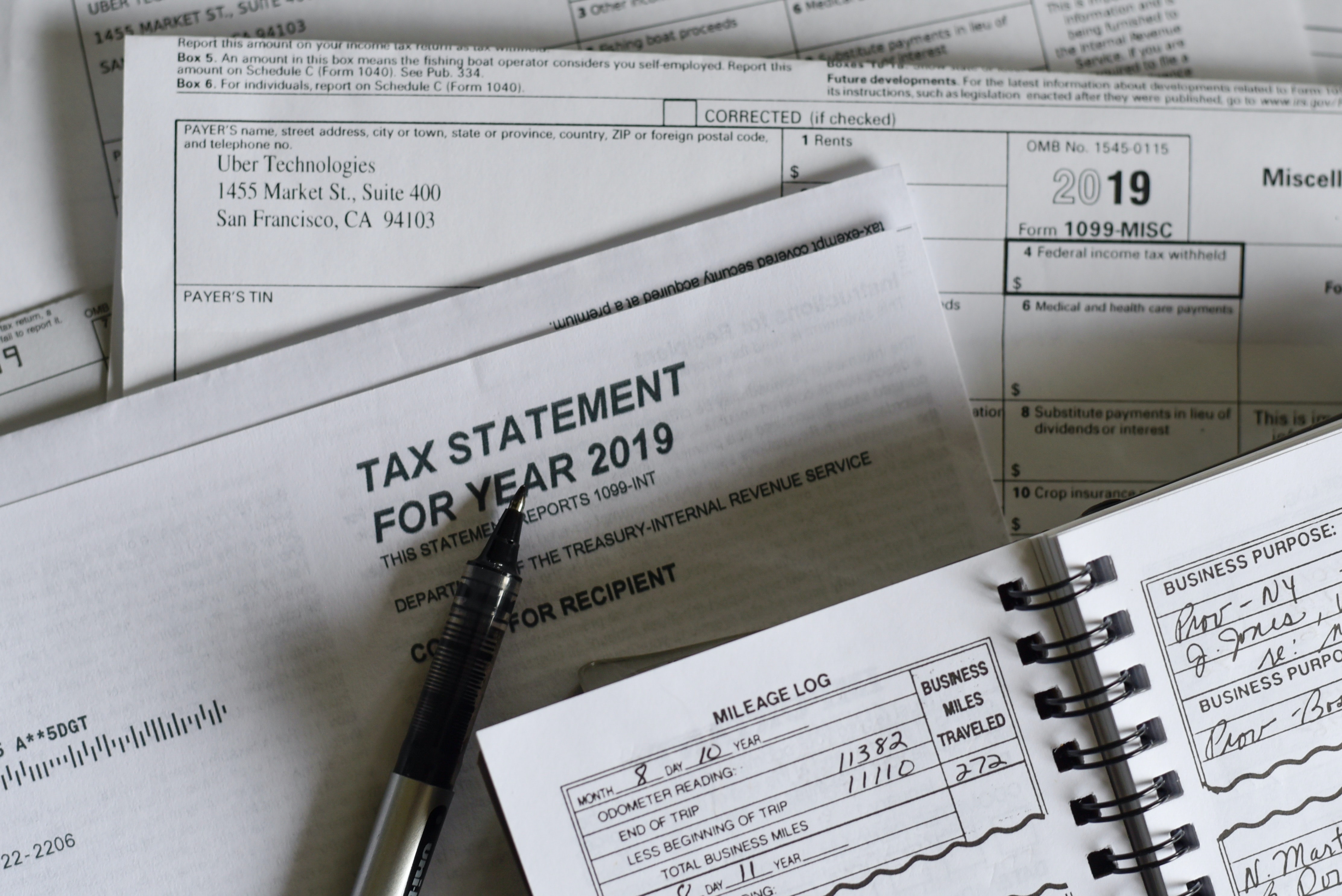 Independent contractor's tax paperwork; image by Olga DeLawrence, via Unsplash.com.