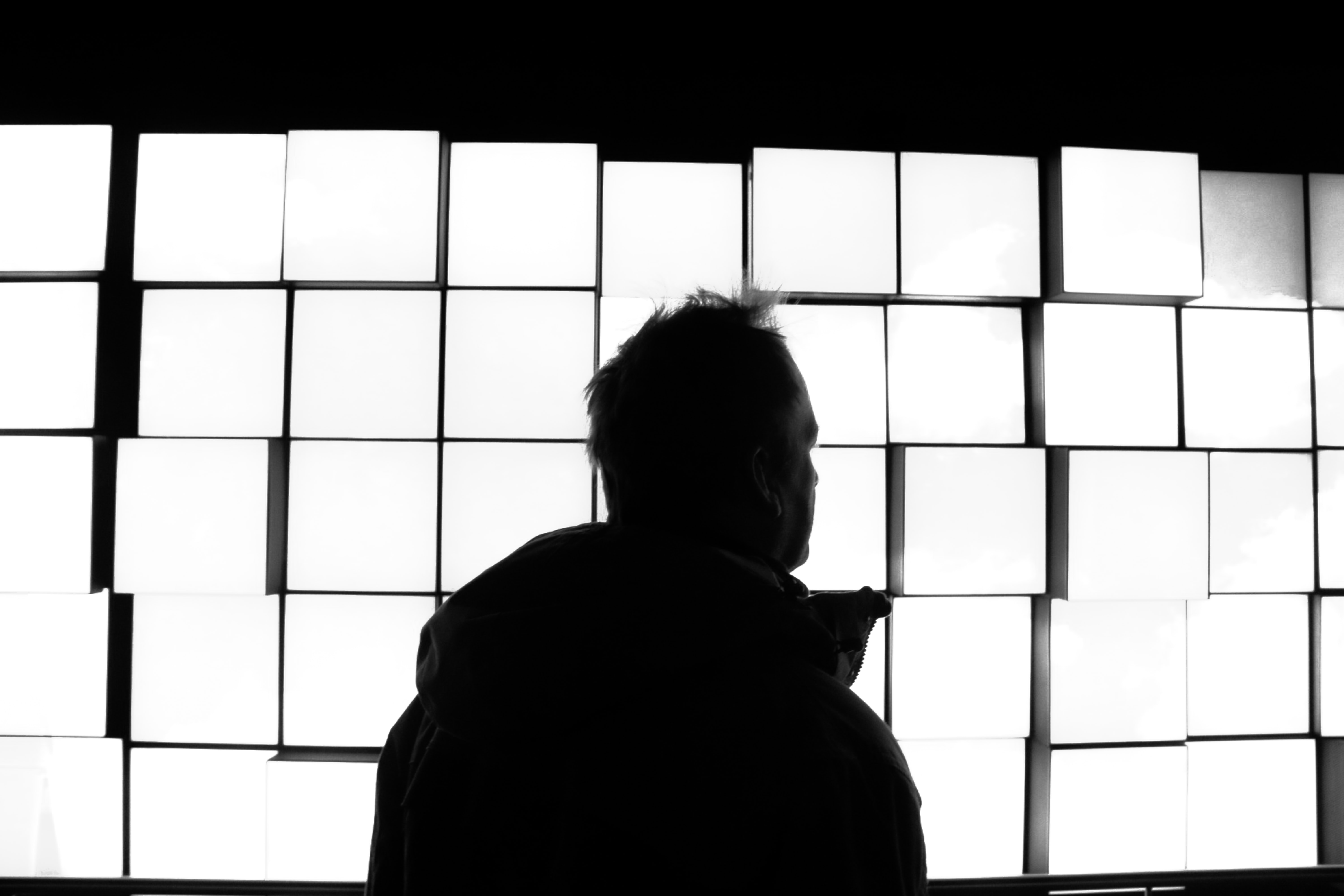 Male silhouette near boxes; image by Sebastiaan Stam, via Unsplash.com.