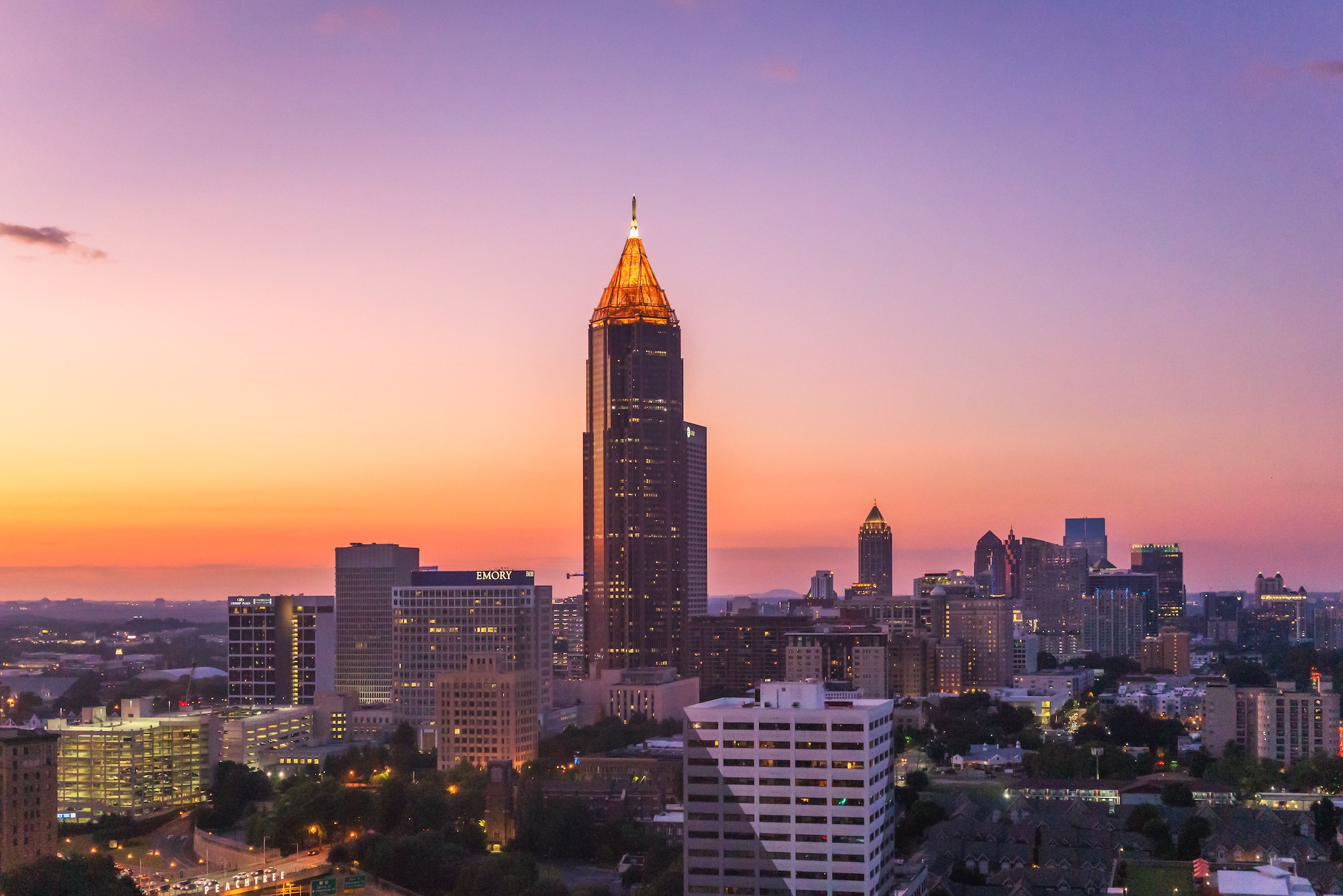 Midtown Atlanta skyline at just after sunset; image by Brad Huchteman, via Unsplash.com.