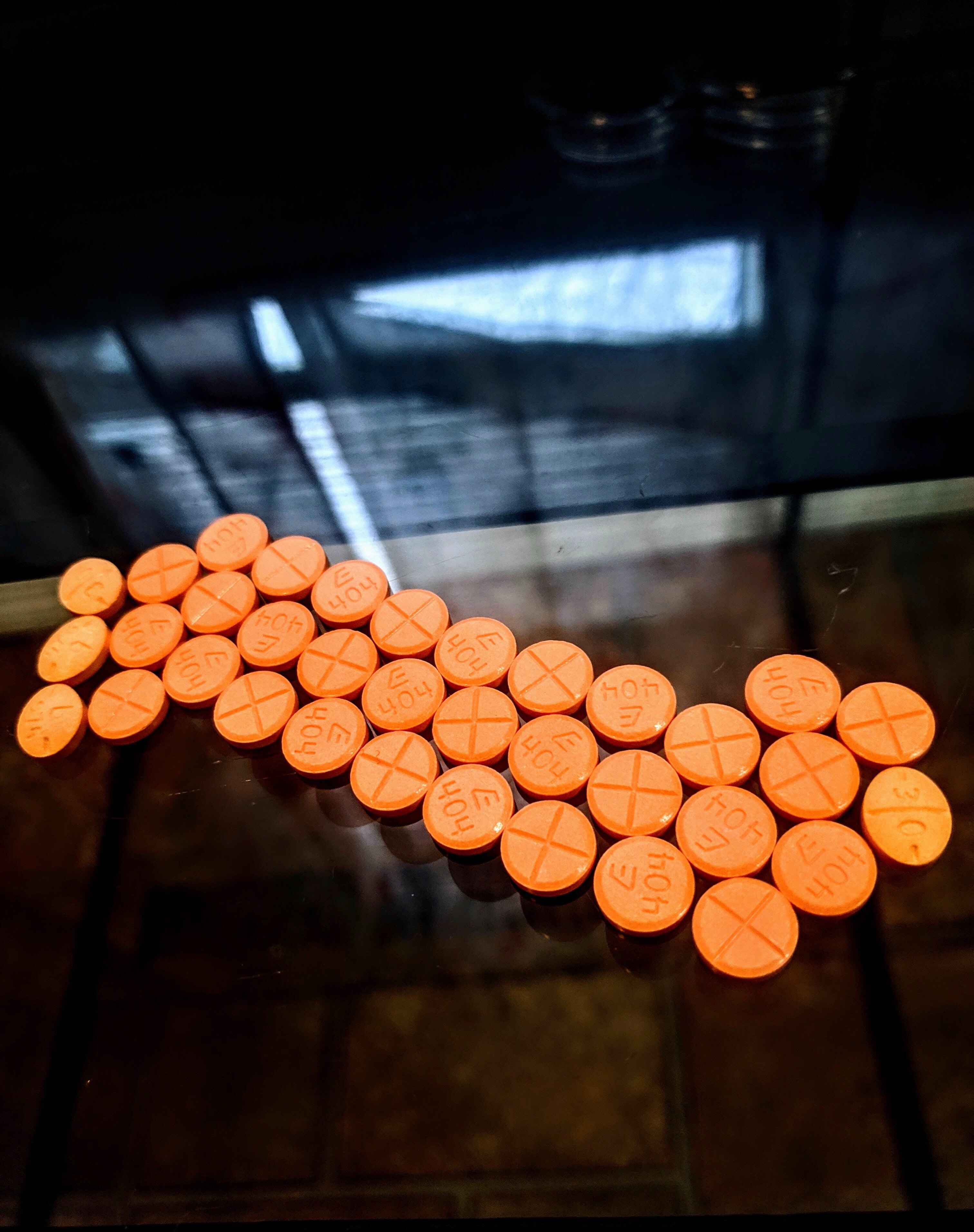 Adderall orange pills; image by James Paul, via Unsplash.com.