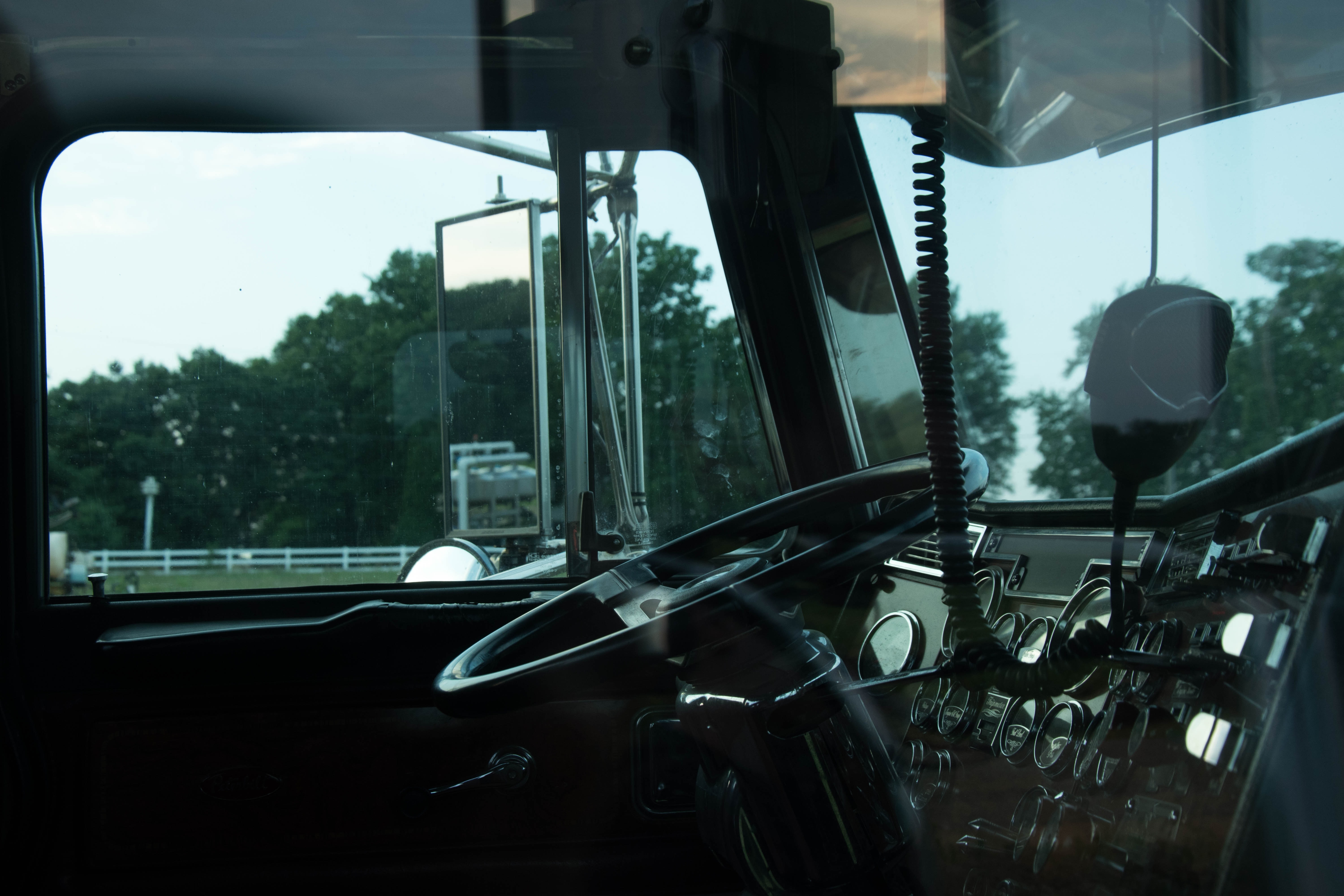 Inside cabin of semi-truck; image by Jason Mitrione, via Unsplash.com.