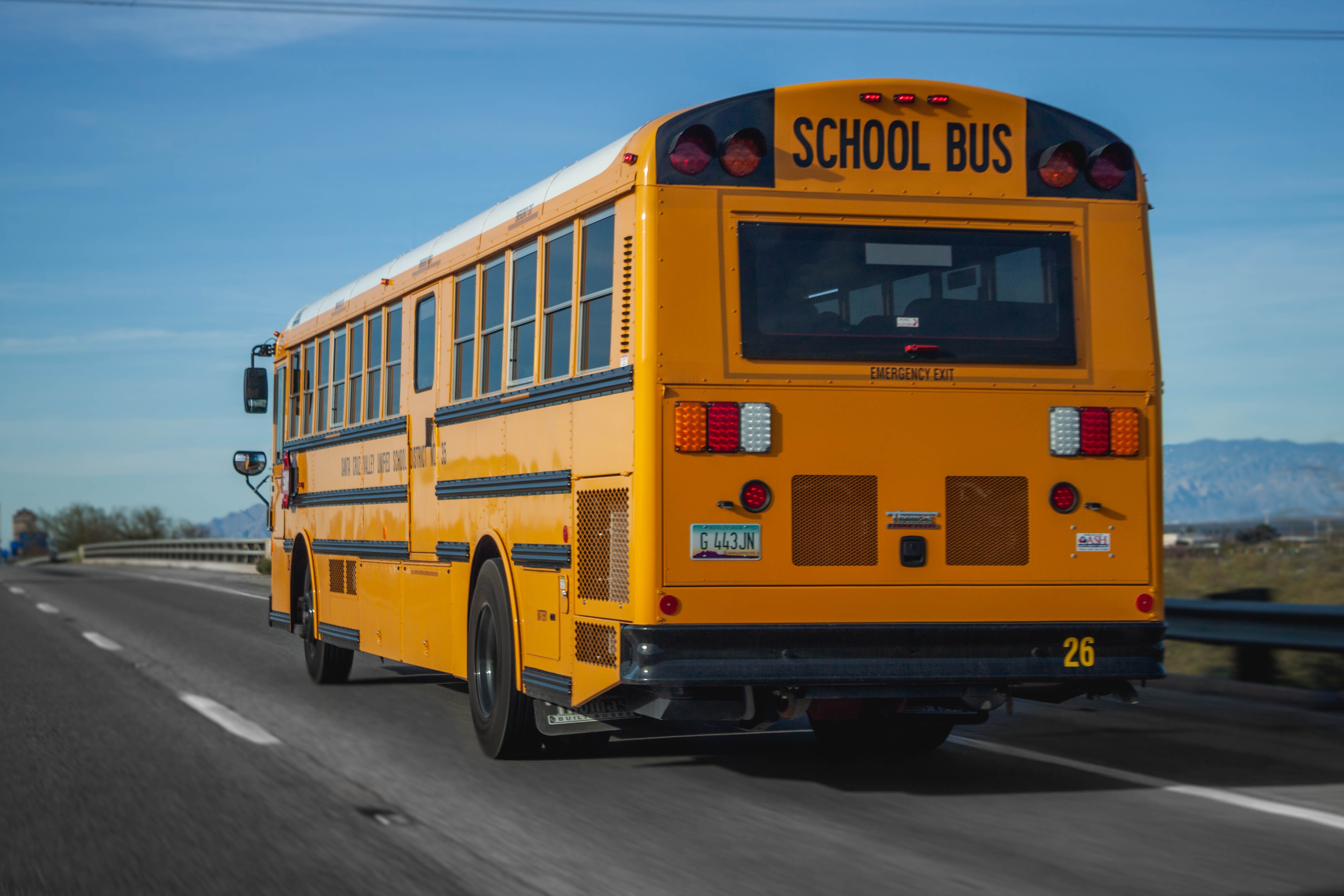School bus on the road; image by Elijah Ekdahl, via Unsplash.com.