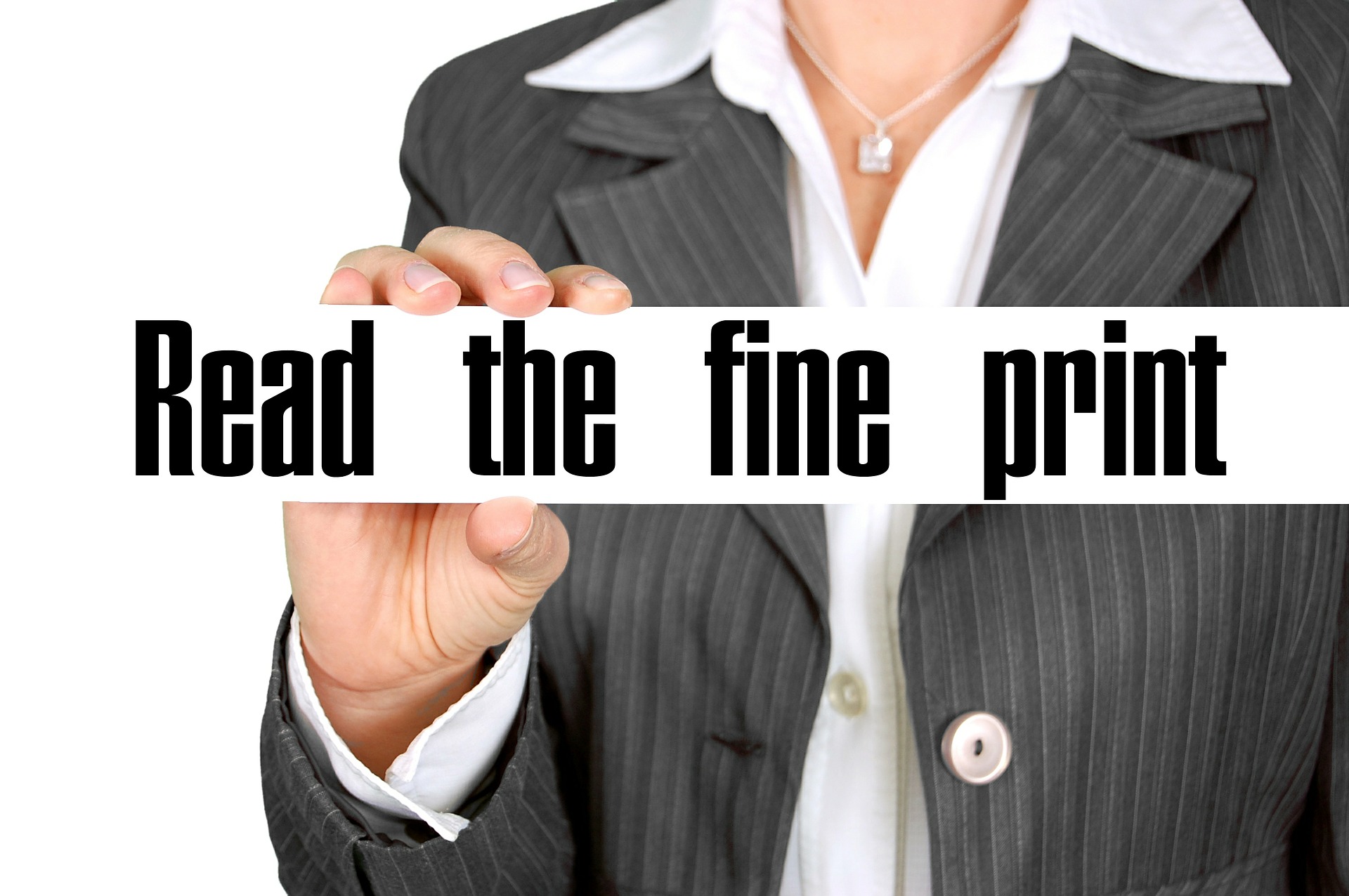 Woman holding sign that says Read the Fine Print; image by Geralt, via Pixabay.com.