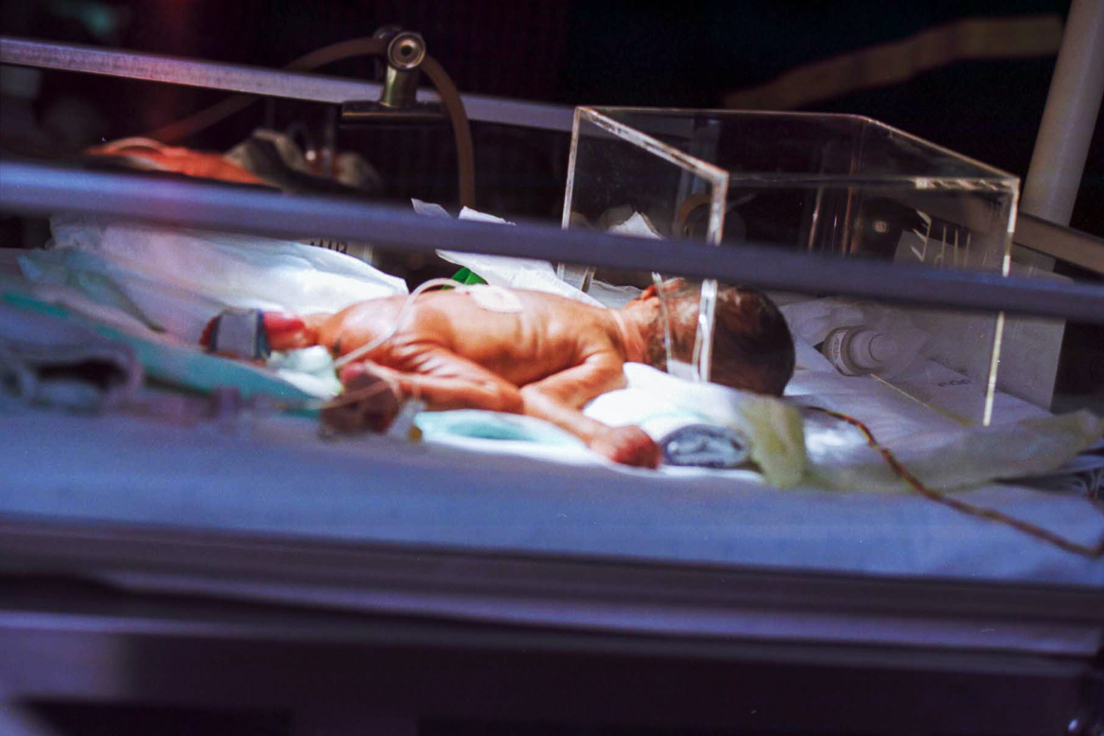 Infant in incubator; image by Hush Naido Jade Photography, via Unsplash.com.
