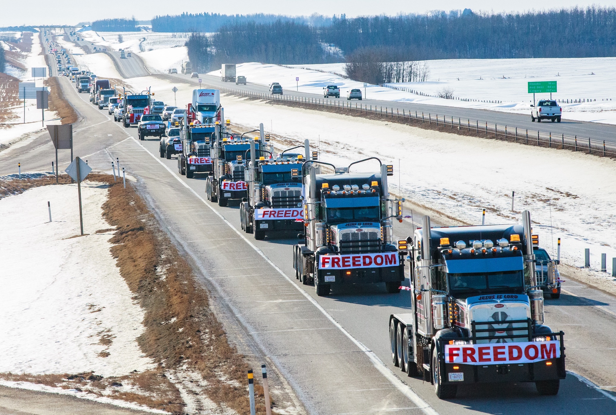 FREEDOM convoy taken in Central Alberta on their way to the Legislature Building; image by Naomi Mckinney, via Unsplash.com.