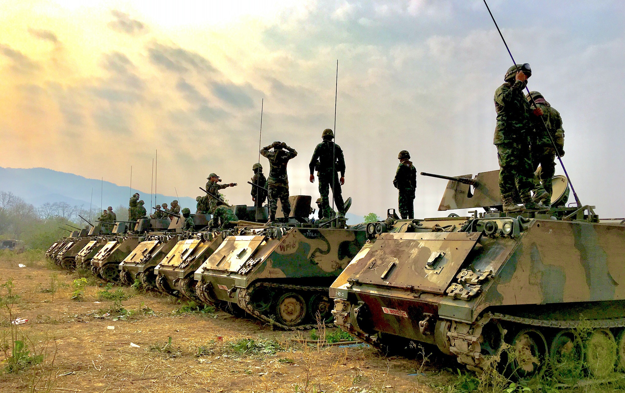 Tanks and troops; image by Chuanchai Pundej, via Unsplash.com.
