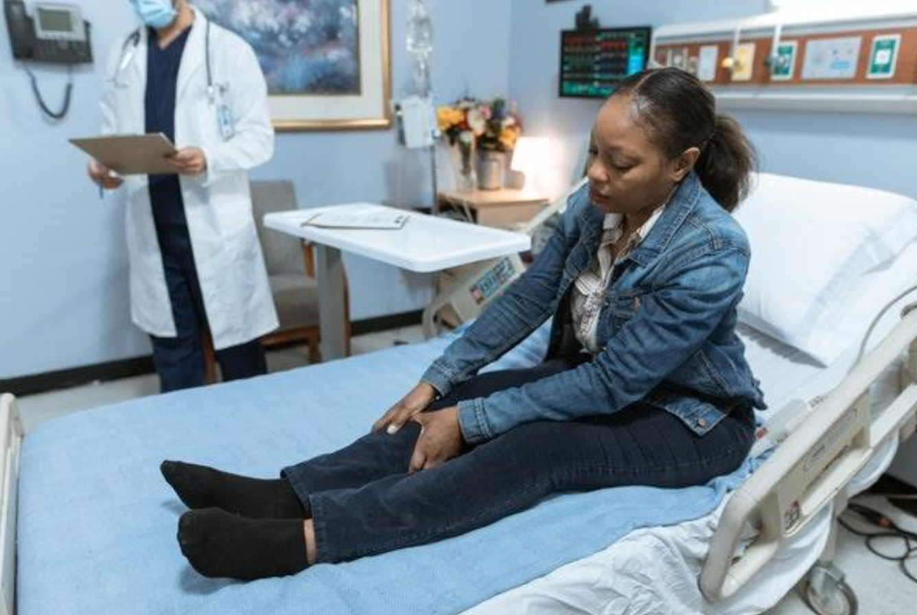 Woman on gurney in emergency room; image by RODNAE Productions from Pexels.com.