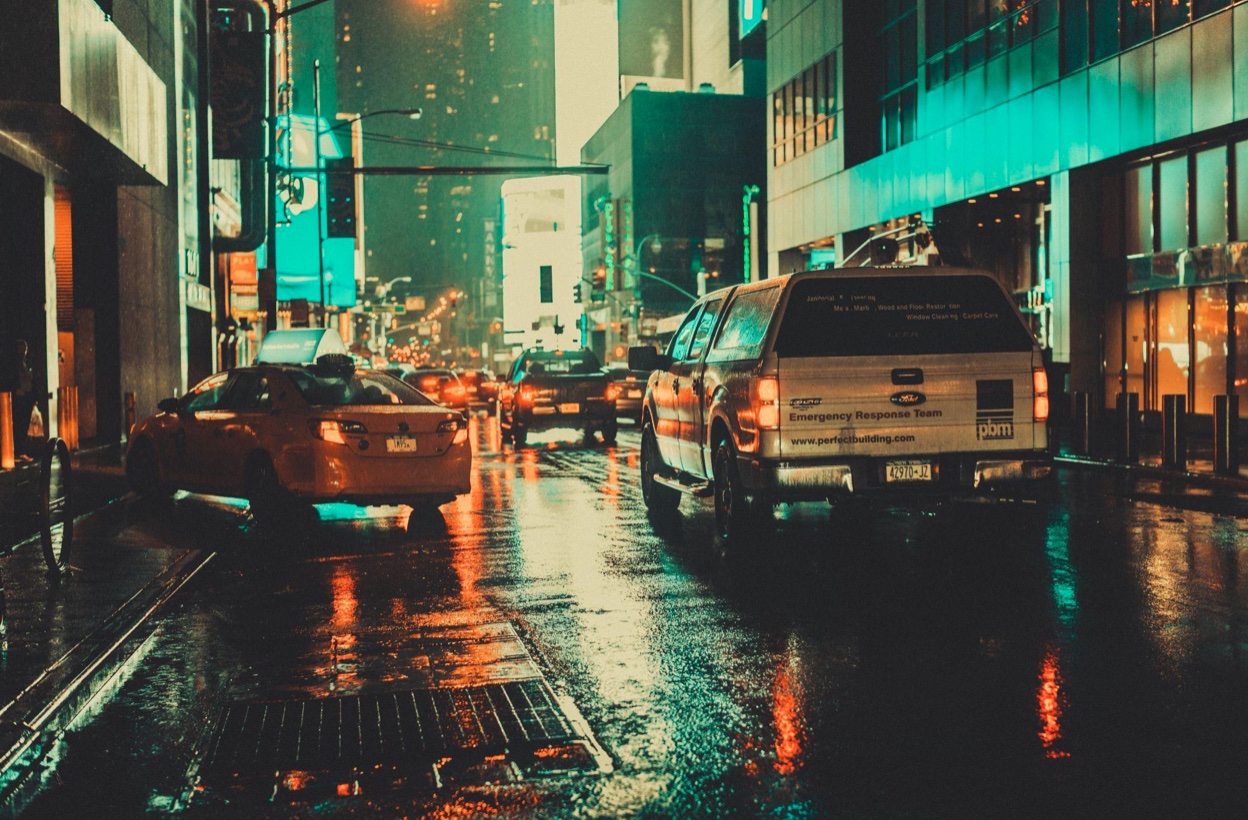 NYC street at night; image by Shalvee Jodagee, via Unsplash.com.