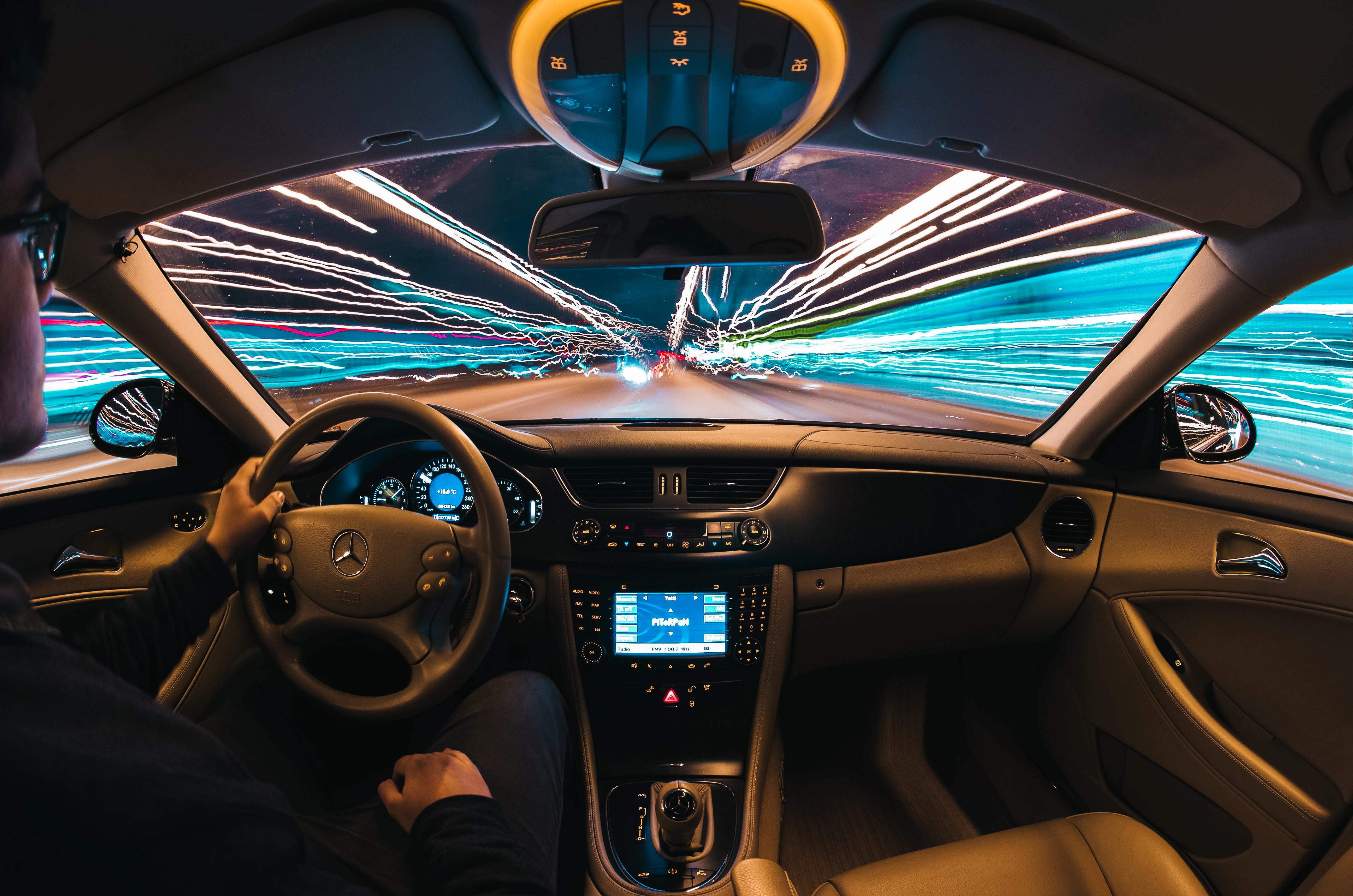 Time lapse photo of man driving; image by Samuele Errico Piccarini, via Unsplash.com.