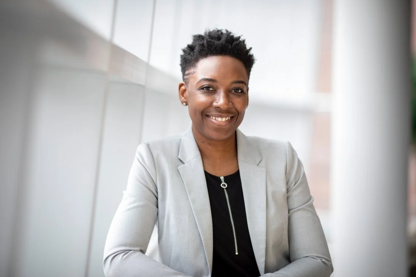 Woman in suit; image by Emmy E, via Pexels.com.