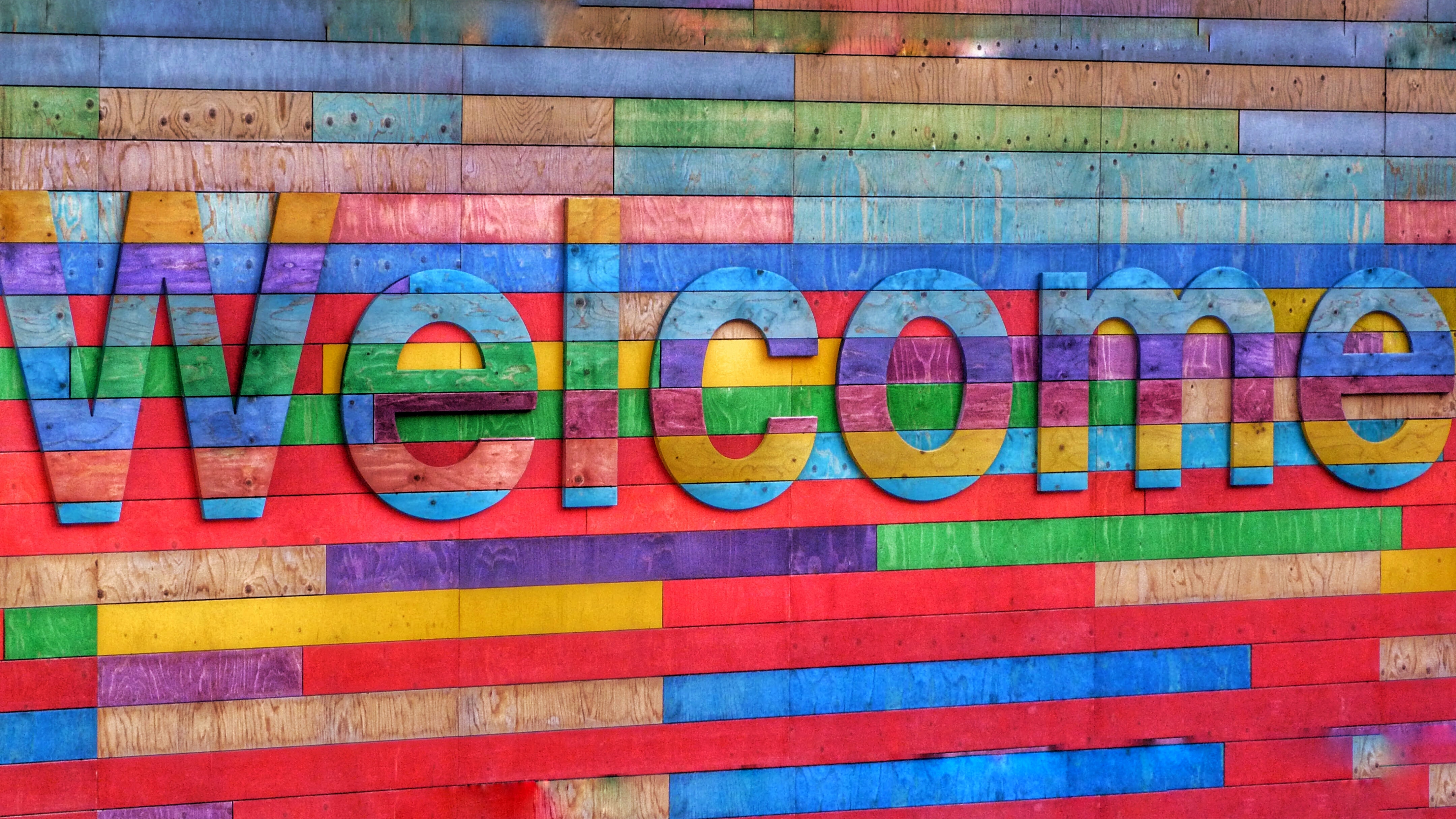 3D painting of the word Welcome in several colors; image by Belinda Fewings, via Unsplash.com.