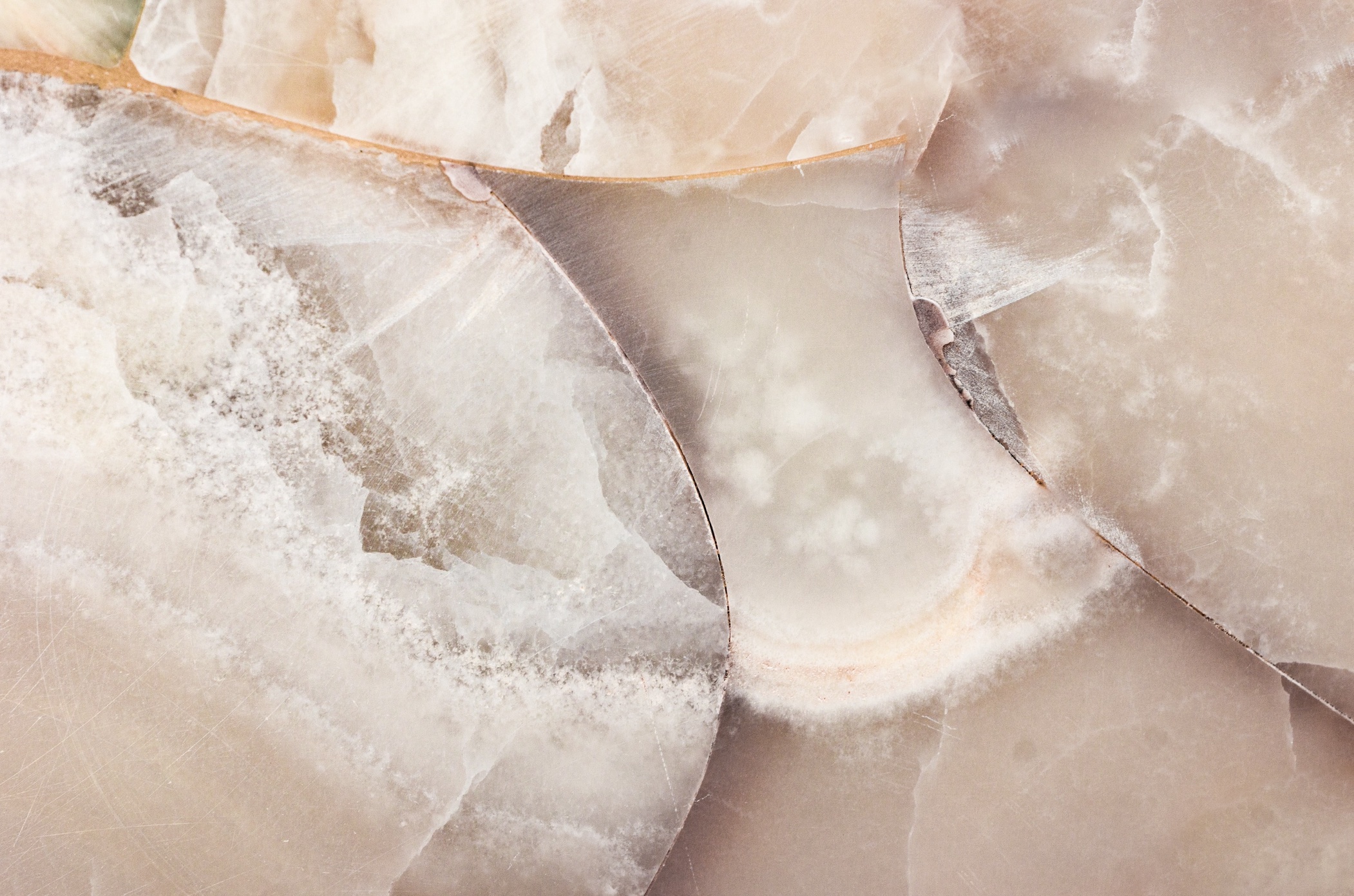 Close up texture of mineral stone, white quartz; image by Olga Thelavart, via Unsplash.com.
