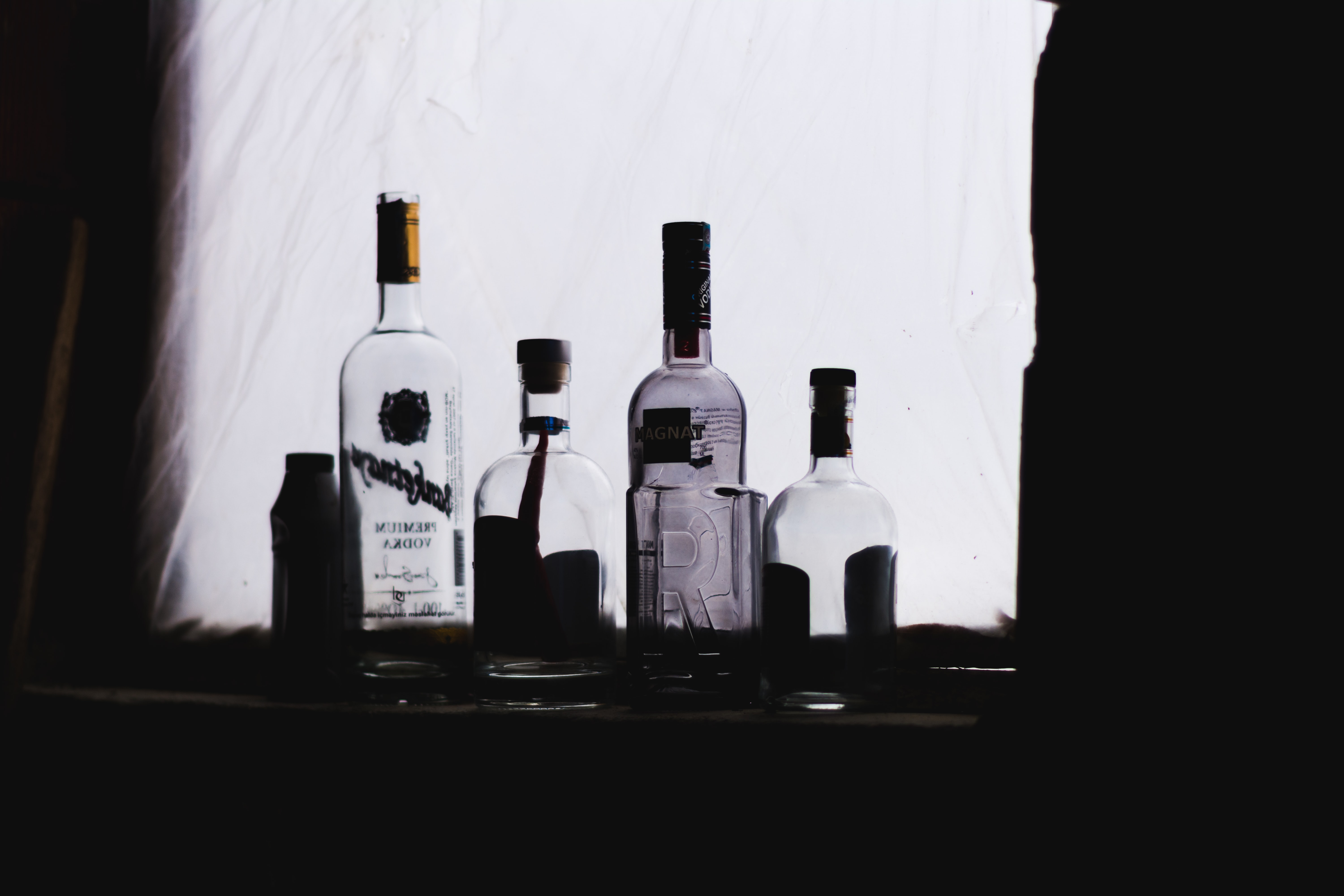 Group of alcohol bottles; image by Orkhan Farmanli, via Unsplash.com.