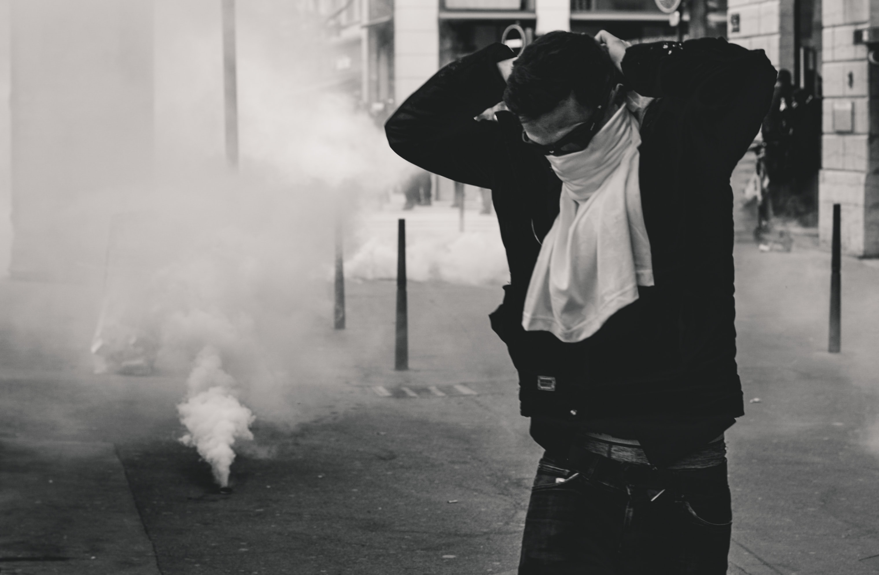 Police fires tear gas grenades on protestors on the streets of Lyon, France, during the 25th weekend of Yellow Vest protests. Image by Ev, via Unsplash.com.