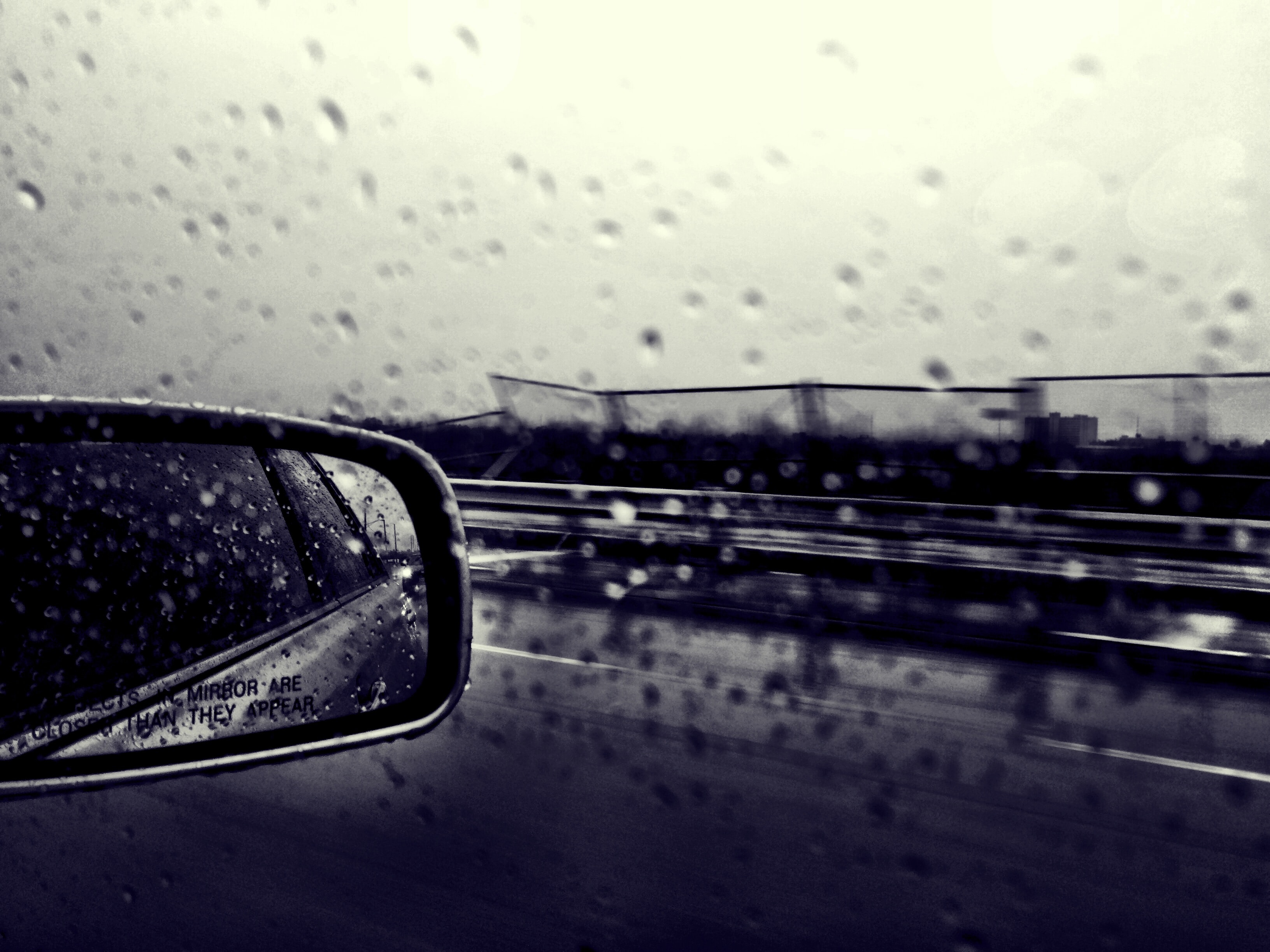 Rear view mirror; image by Elly Filho, via Unsplash.com.
