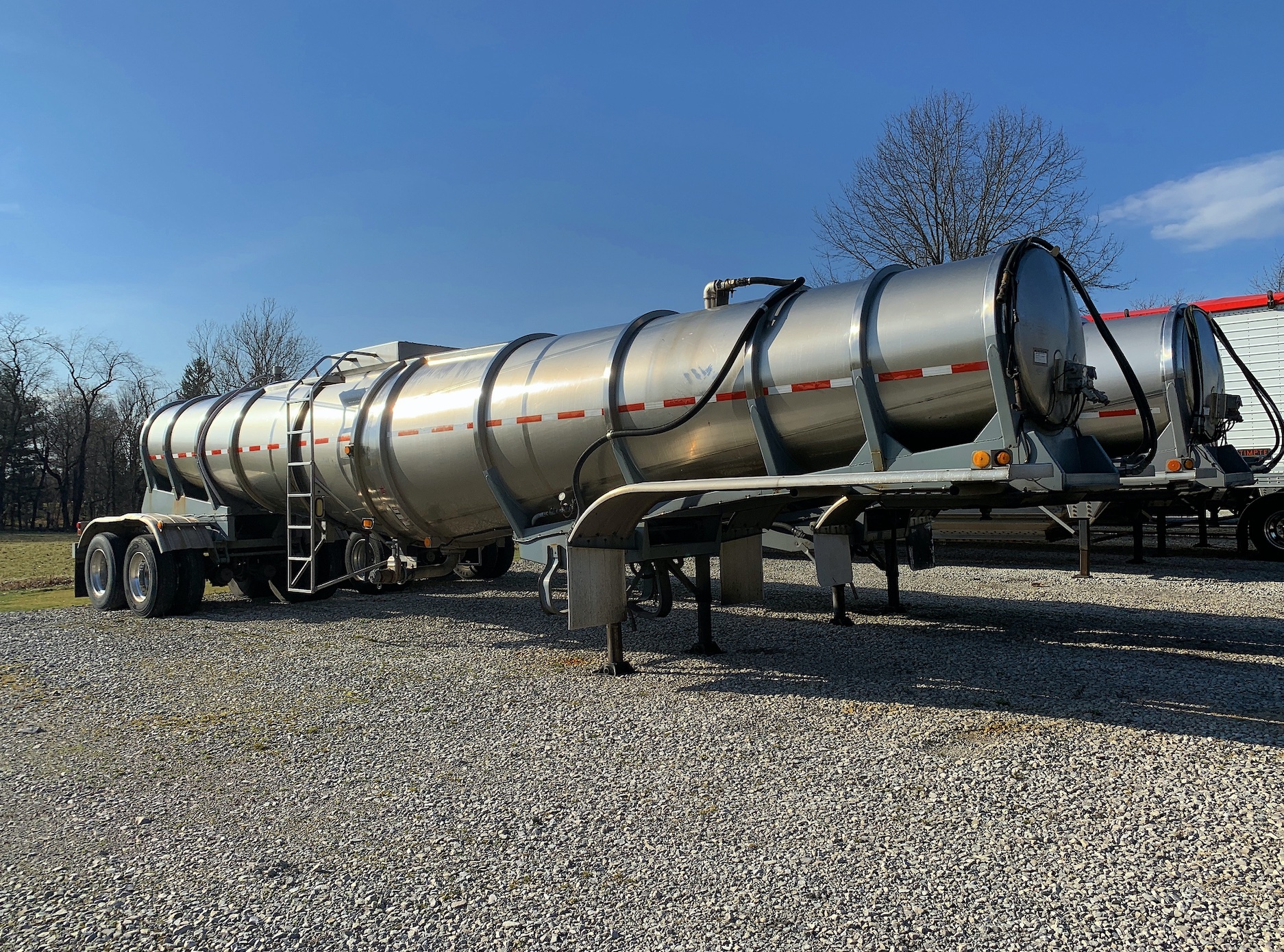 Two tanker-truck tanks without the trucks; image by Leslie Saunders, via Unsplash.com.