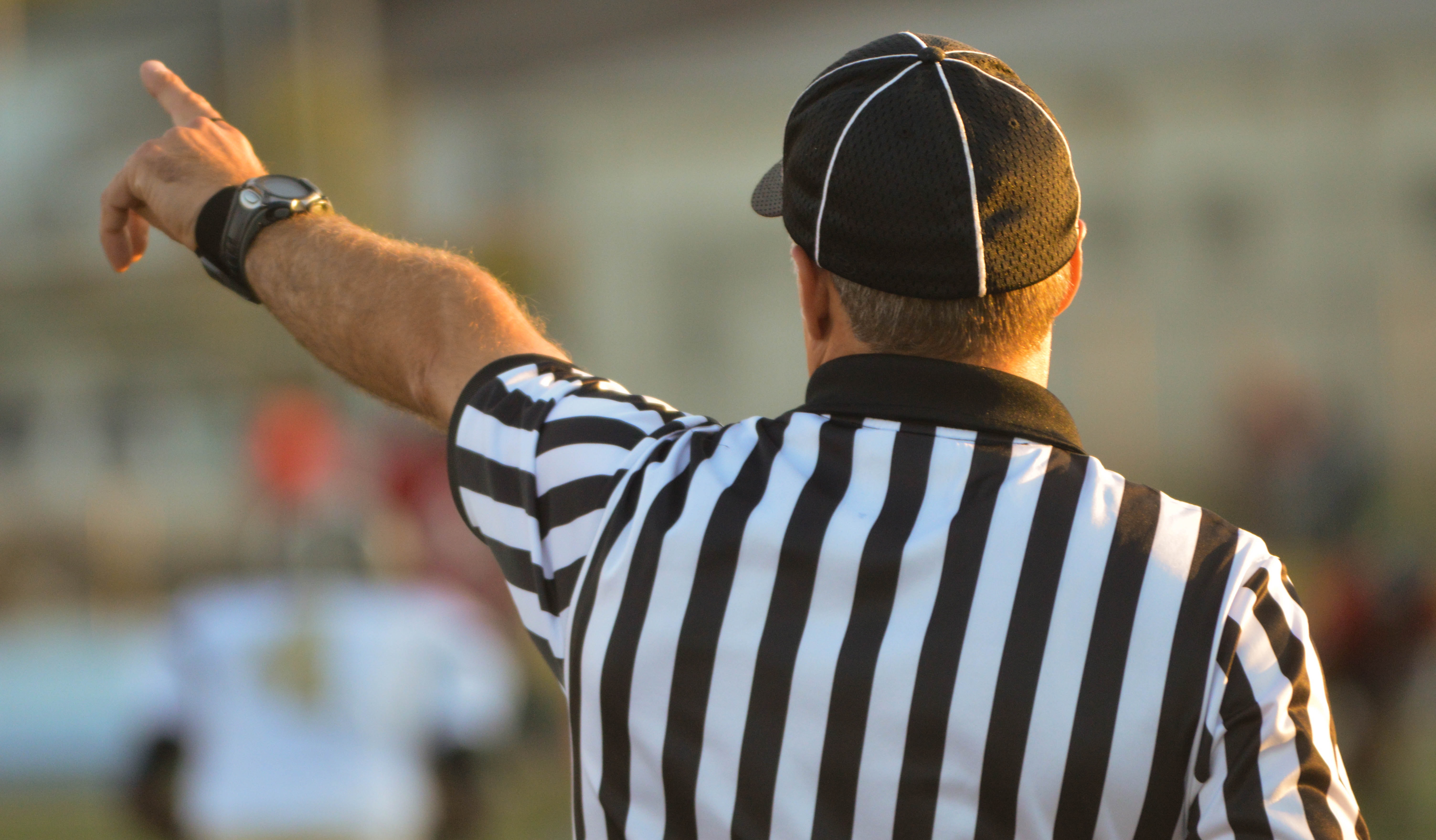 You're out! Umpire pointing; image by Nathan Shively, via Unsplash.com.