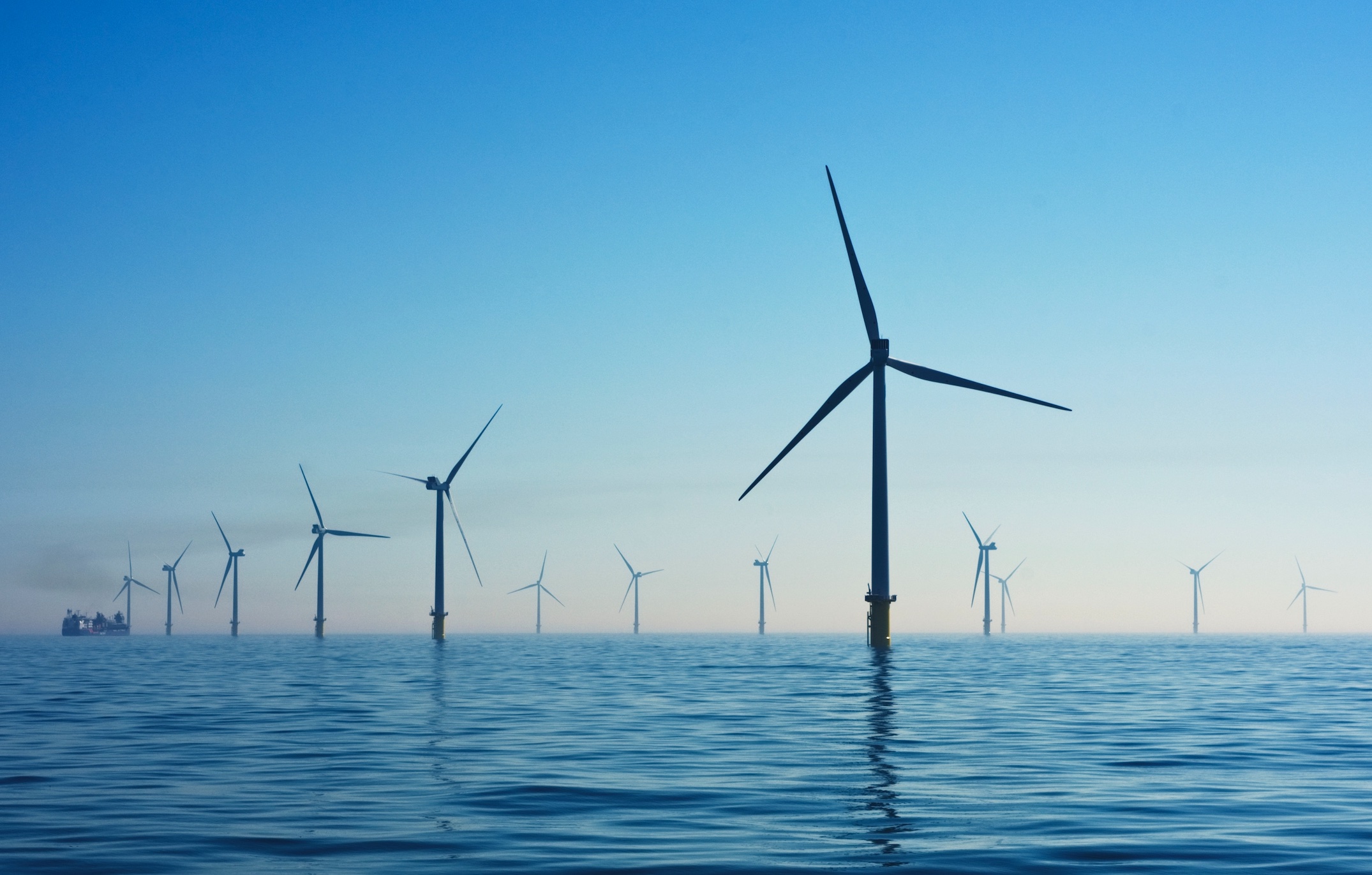 Offshore windmills; image by Nicholas Doherty, via Unsplash.com.