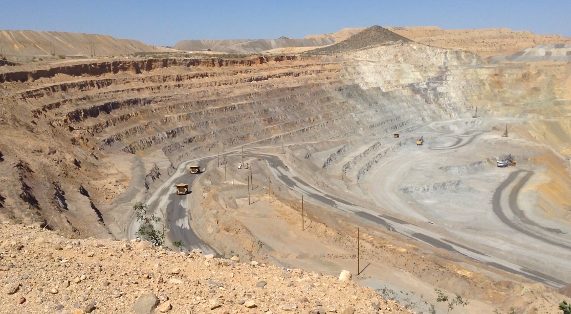 A vast, manmade hole in the ground, from which copper ore is extracted.