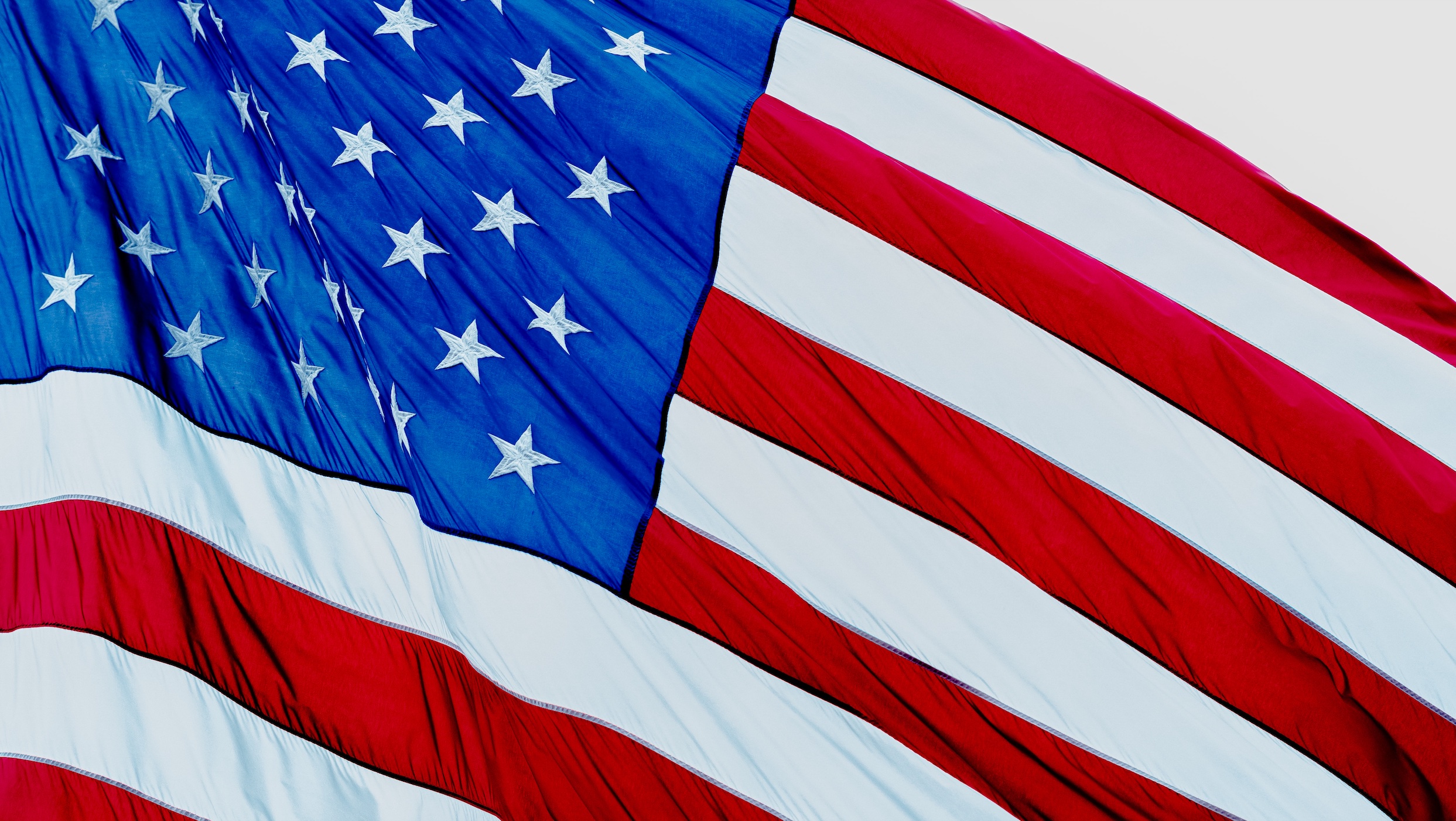 US flag; image by Crystal Huff, via Unsplash.com.