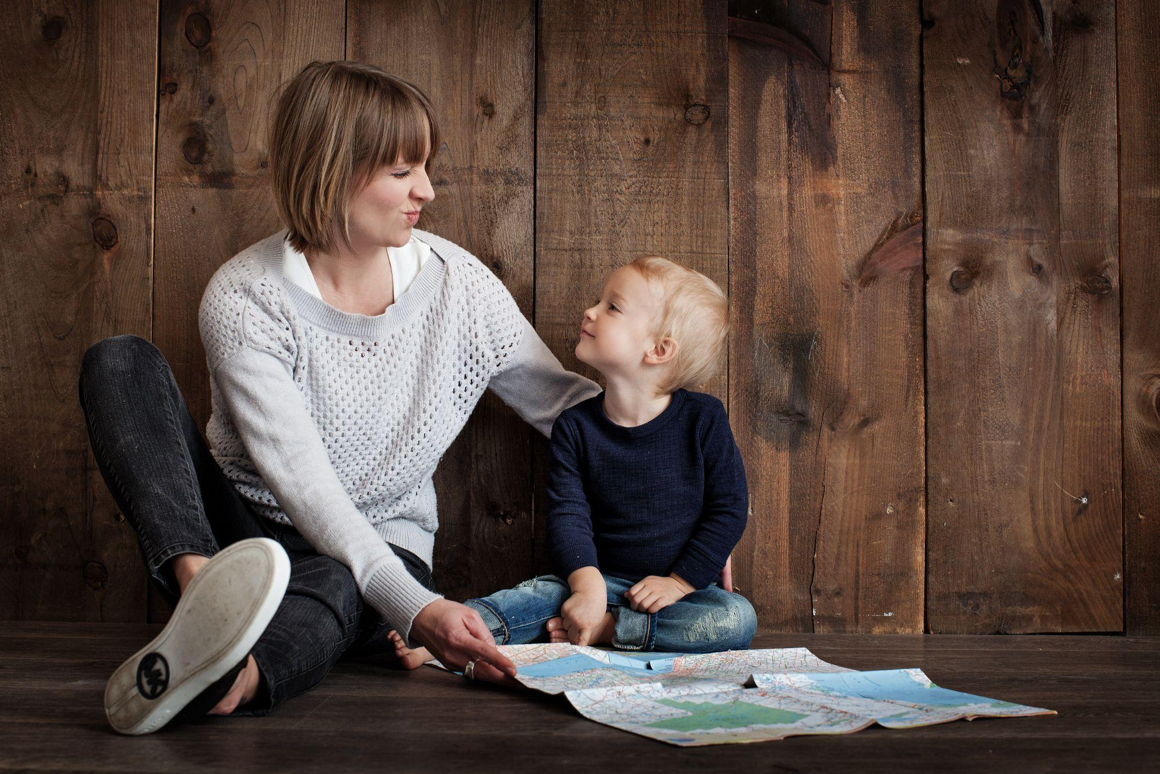 Child with woman holding map; image by Pixabay, via Pexels.com.