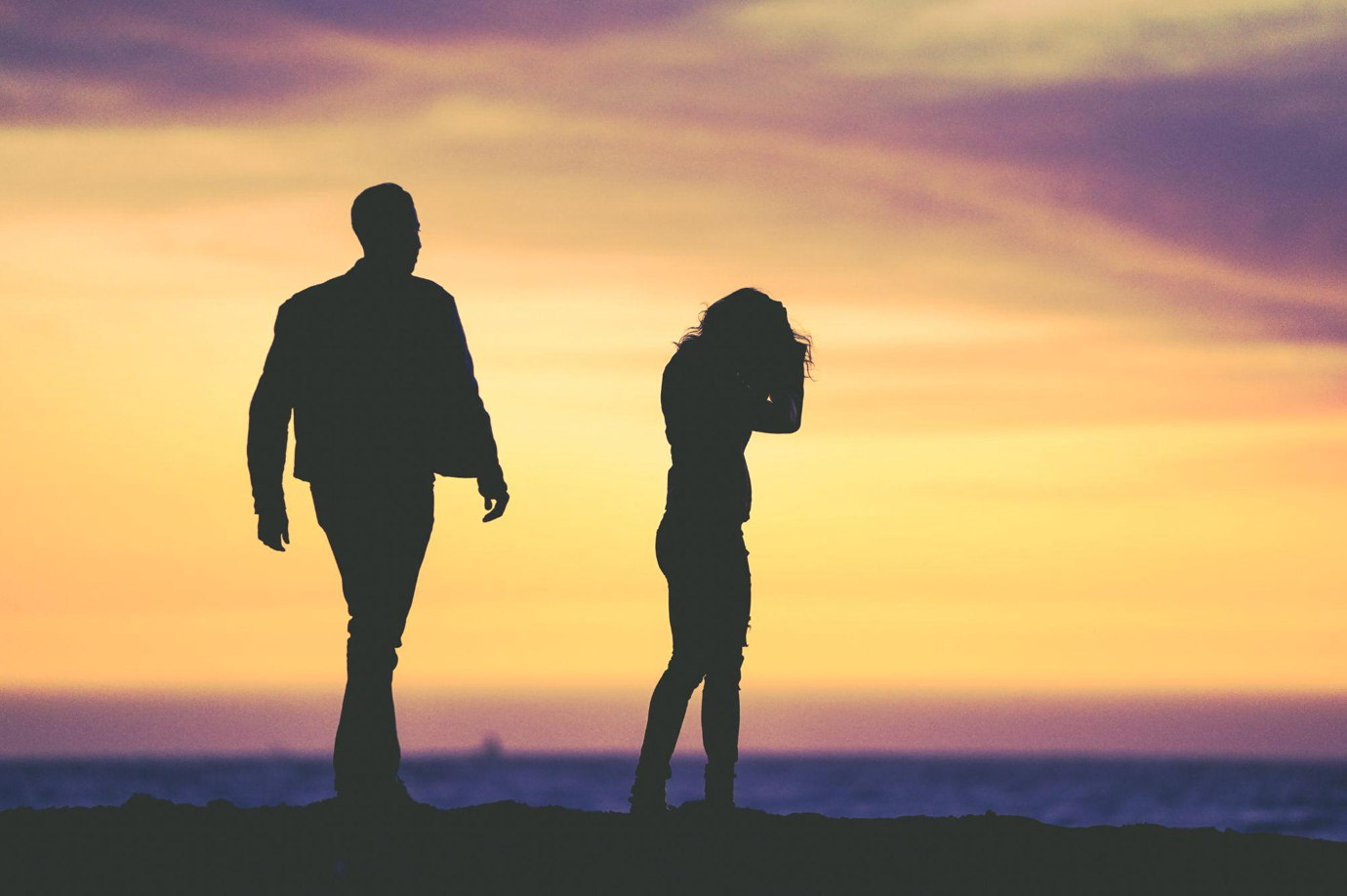 Silhouette of couple against sunset; image by Eric Ward, via Unsplash.com.