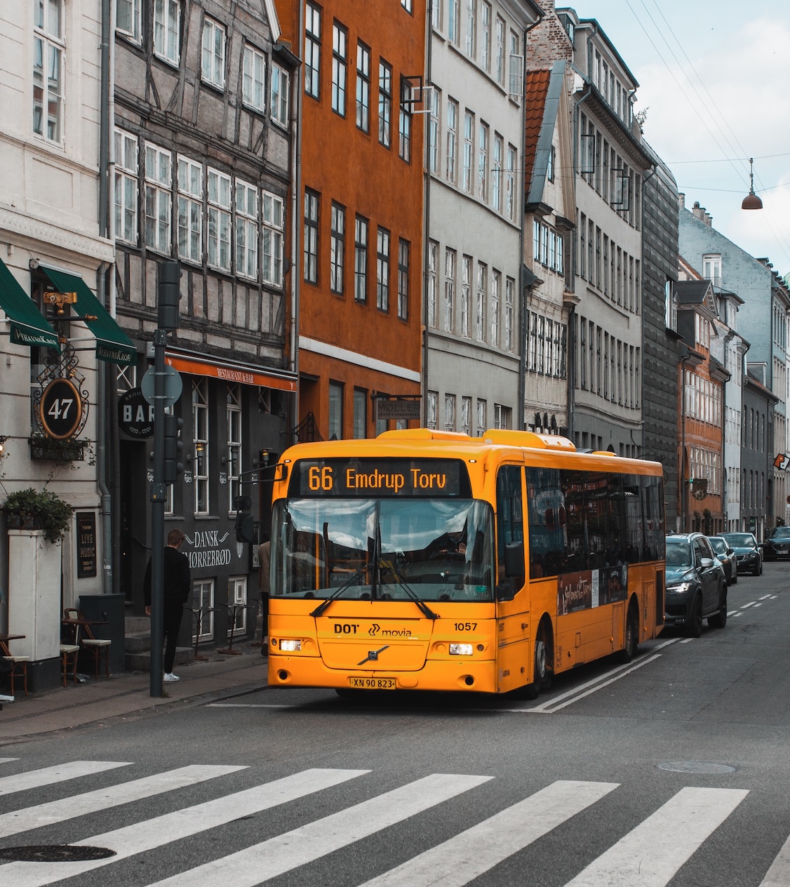 Yellow bus stopped in traffic; image by Teddy O, via Unsplash.com.