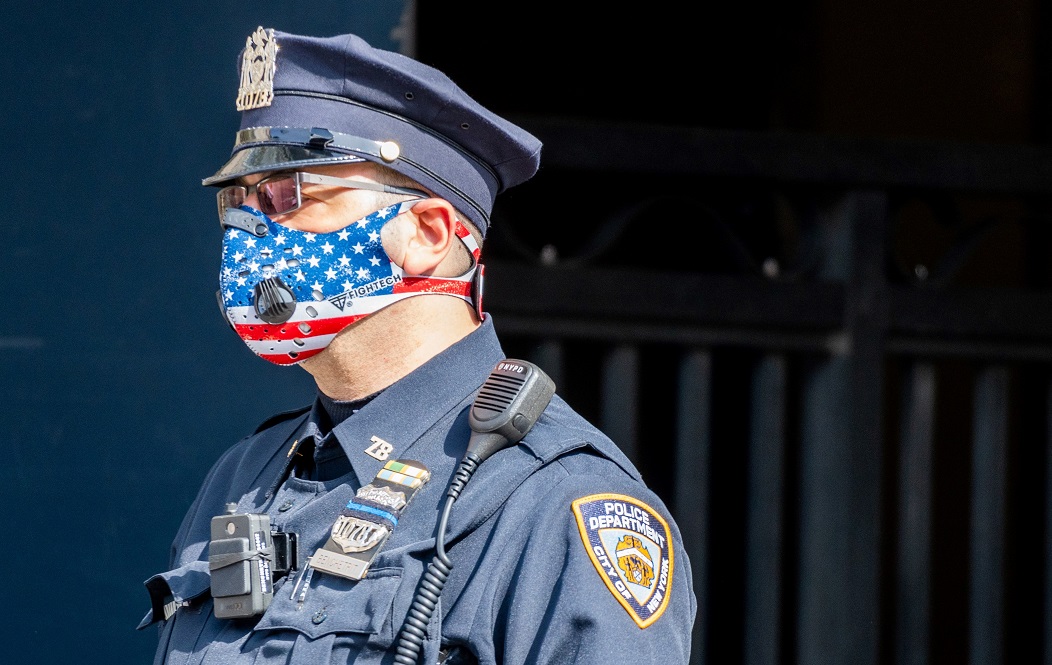 A New York police officer wears a flag-themed N95 mask.