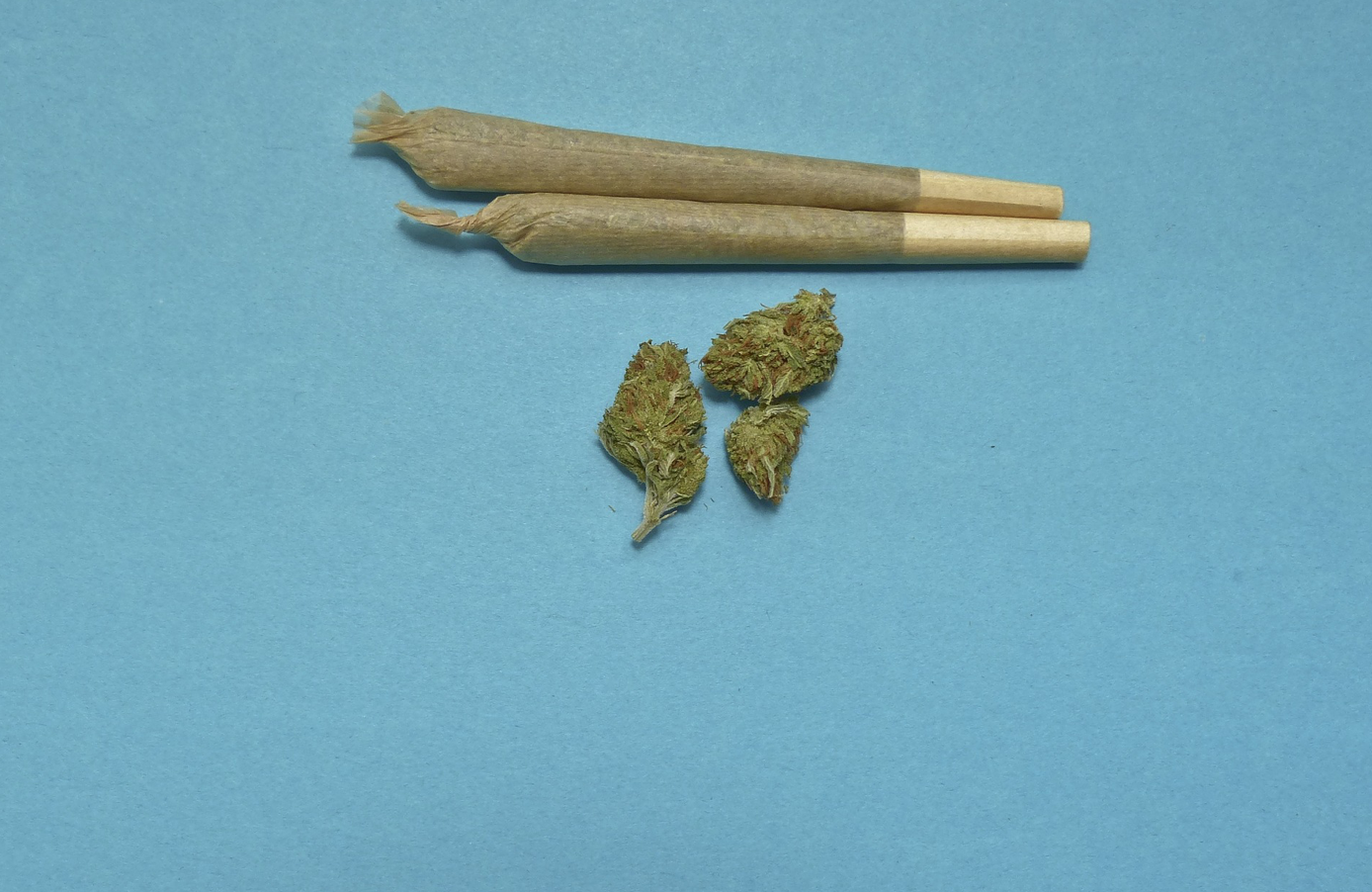 Two pre-rolls and three nugs of weed; image by TechPhotoGal, via Pixabay.com.