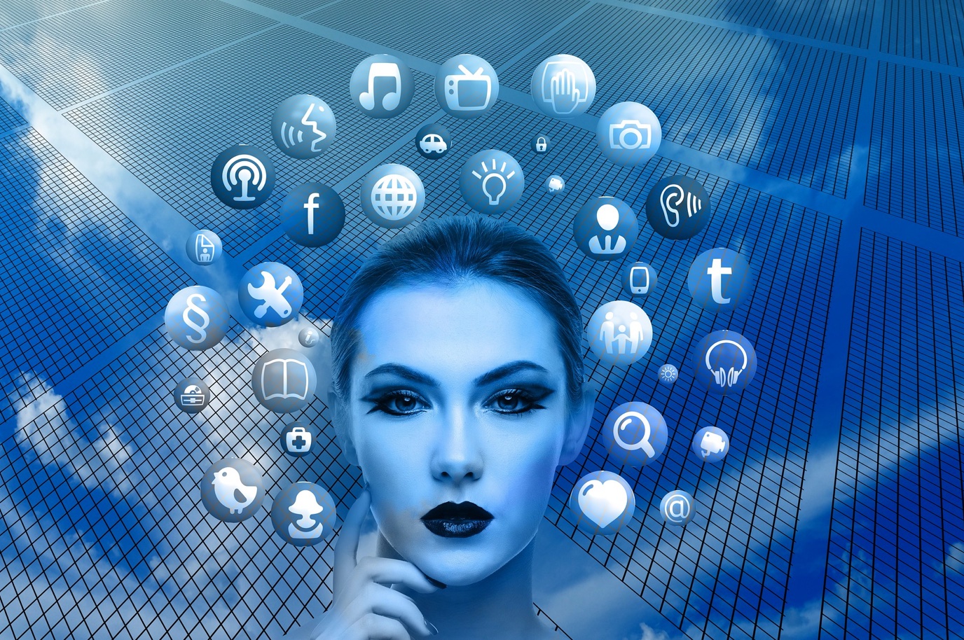 Woman's face surrounded by social media icons; image by geralt, via Pixabay.com.