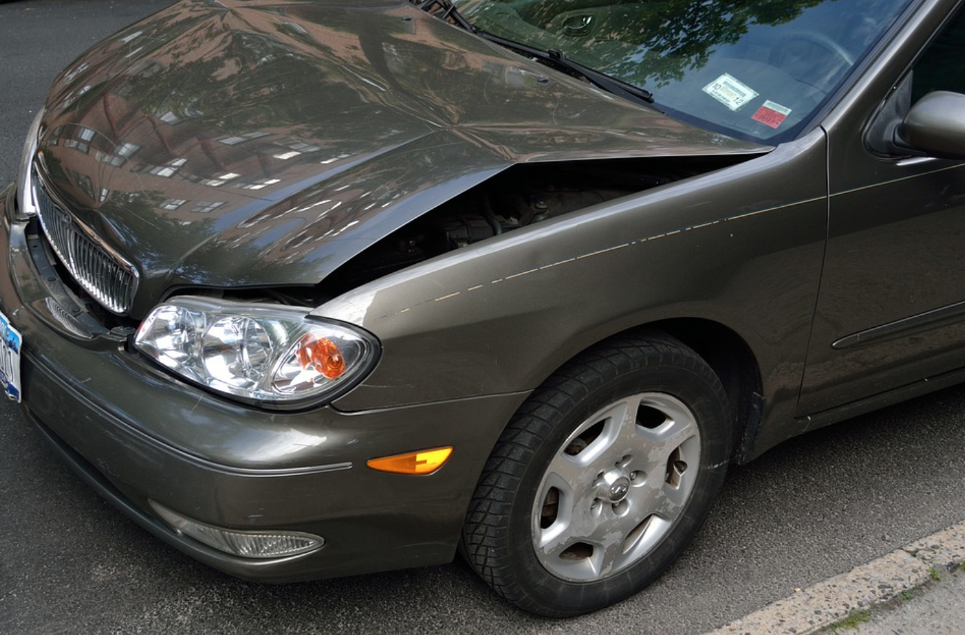 Car with dented hood; image by Artistic Impressions, via Pixabay.com.