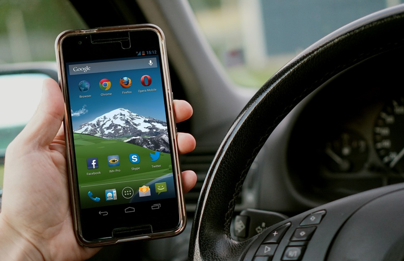 Man talking on cell phone while driving; image by The Digital Way, via Pixabay.com.