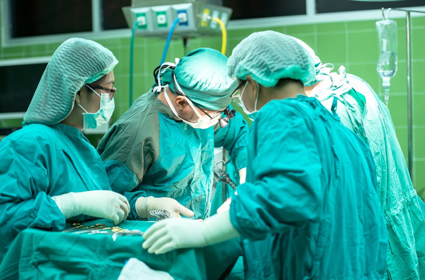 Surgical team at work; image by Sasint, via Pixabay.com.