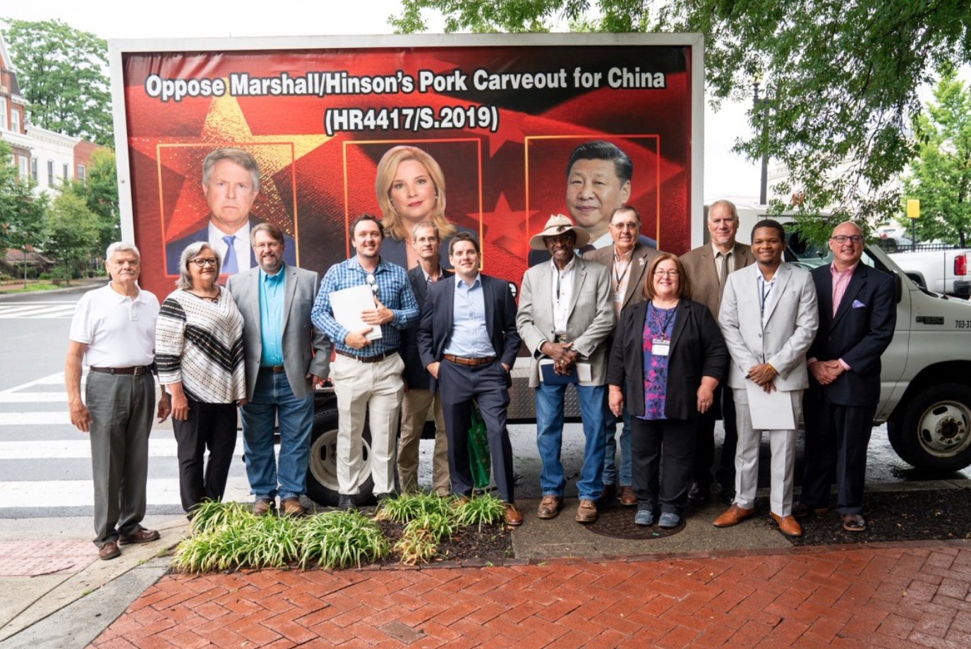 OCM Members in front their billboard truck on Capitol Hill during the July fly-in; image from press release.
