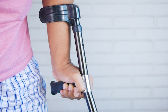Person using cane crutch; image by Towfiqu barbhuiya, via Unsplash.com.