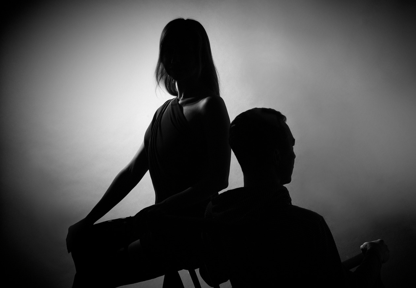 Silhouettes of a man and woman resenting each other; image by R-region, via Pixabay.com.