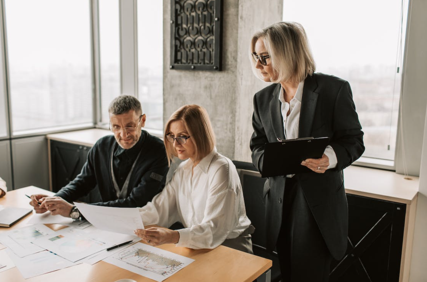 People having a meeting; image by Vlada Karpovich, via Pexels.com.