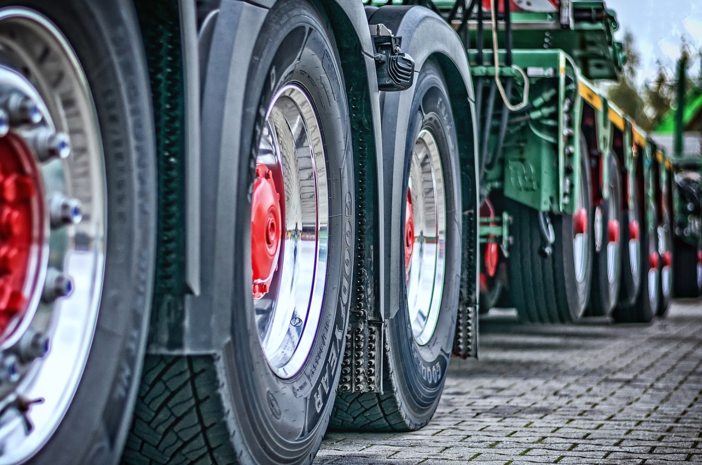 Heavy load tractor pulling semi-truck; image by Tama66, via Pixabay.com.
