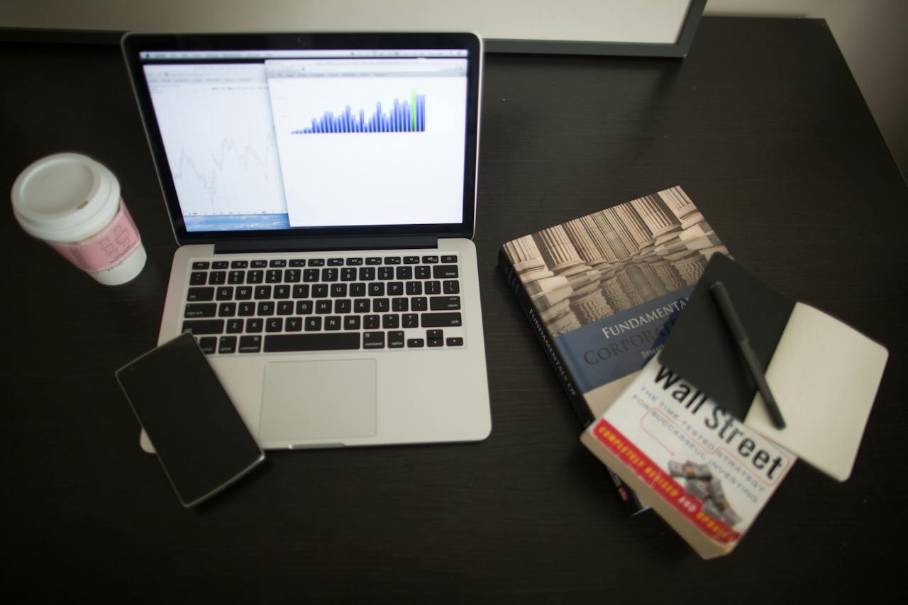 Laptop and books on table; image by Pixabay, via Pexels.com.