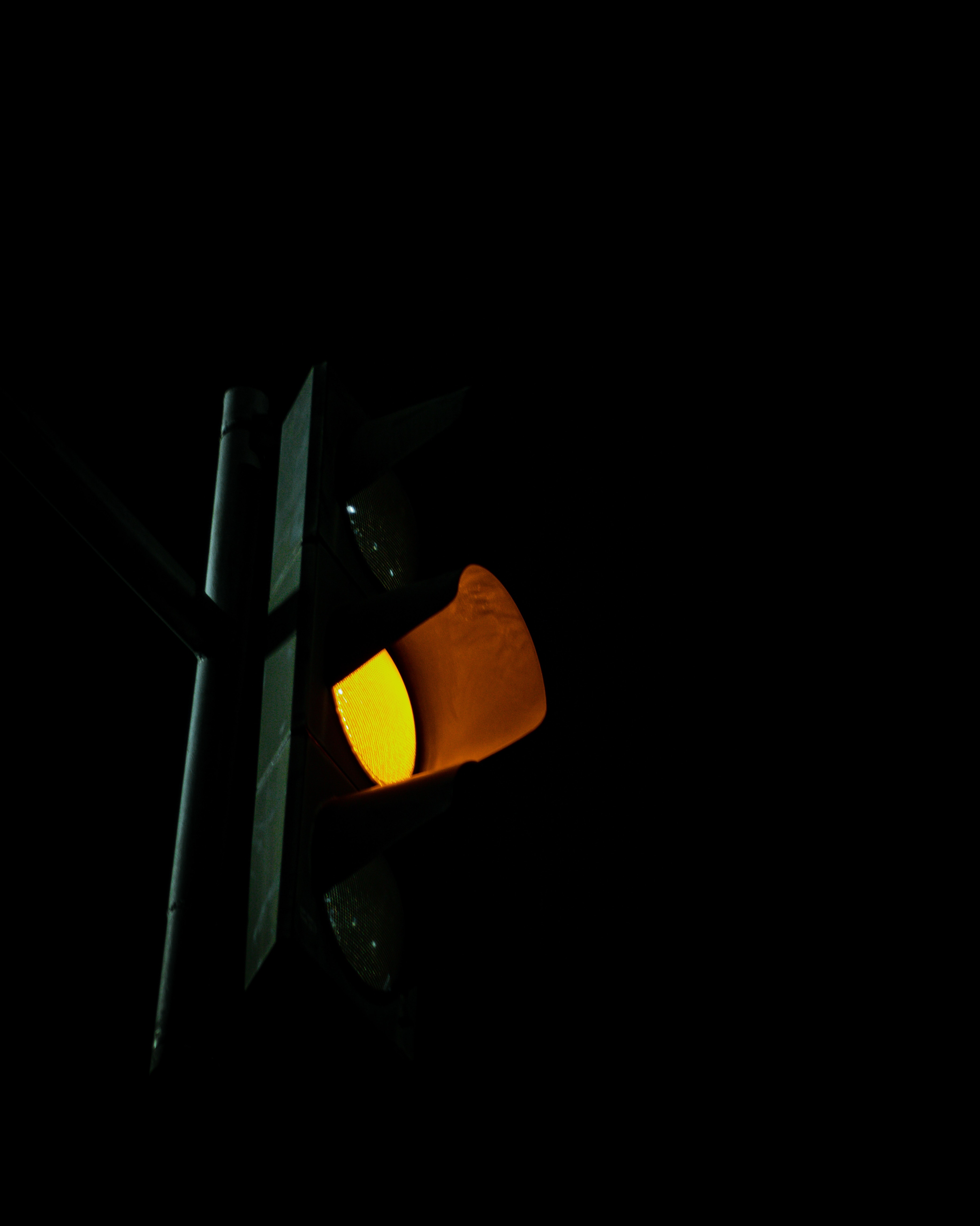 Yellow traffic light; image by Fadhila Nurhakim, via Unsplash.com.