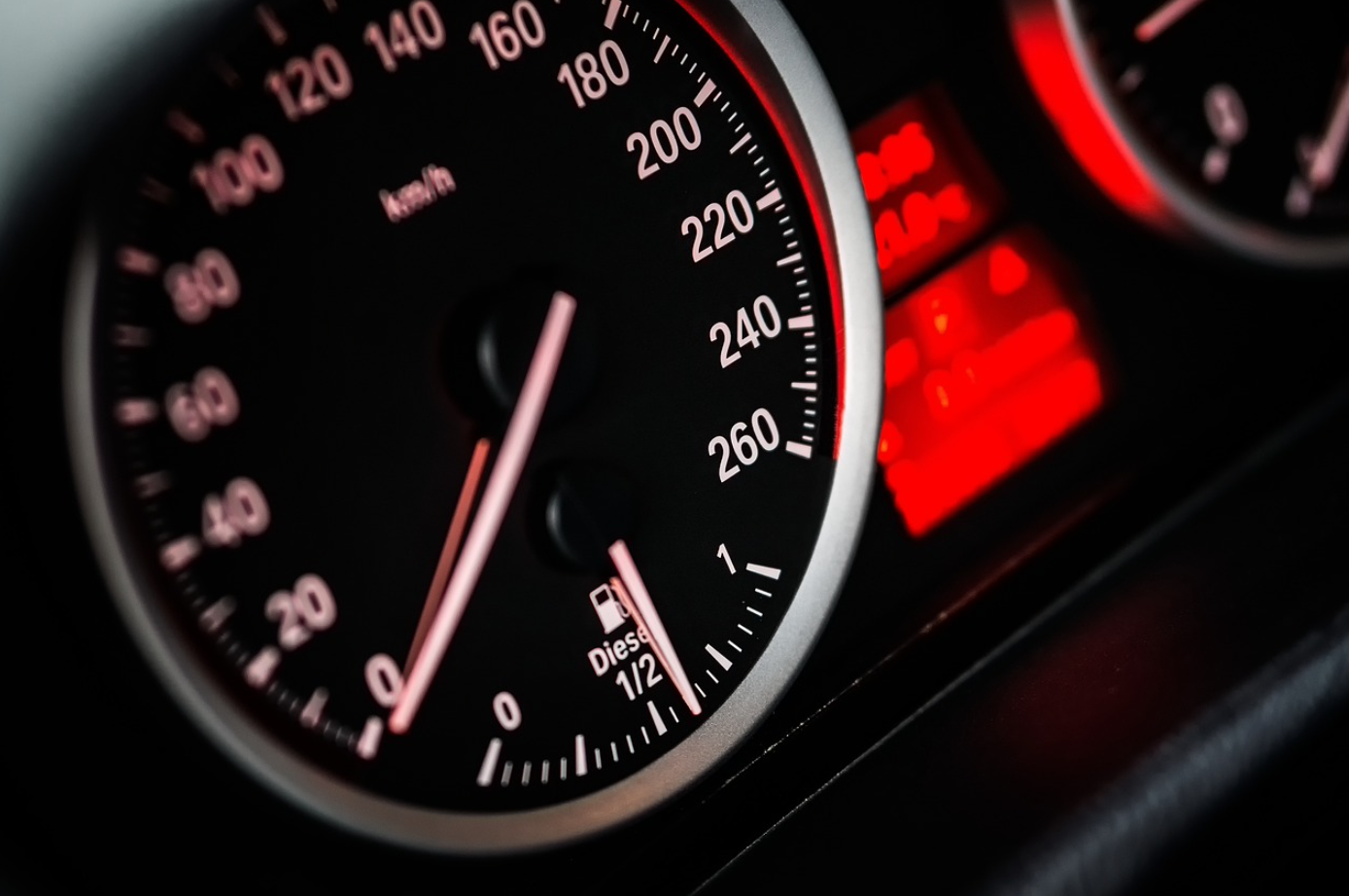 Close-up of car speedometer; image by Qimono, via Pixabay.com.