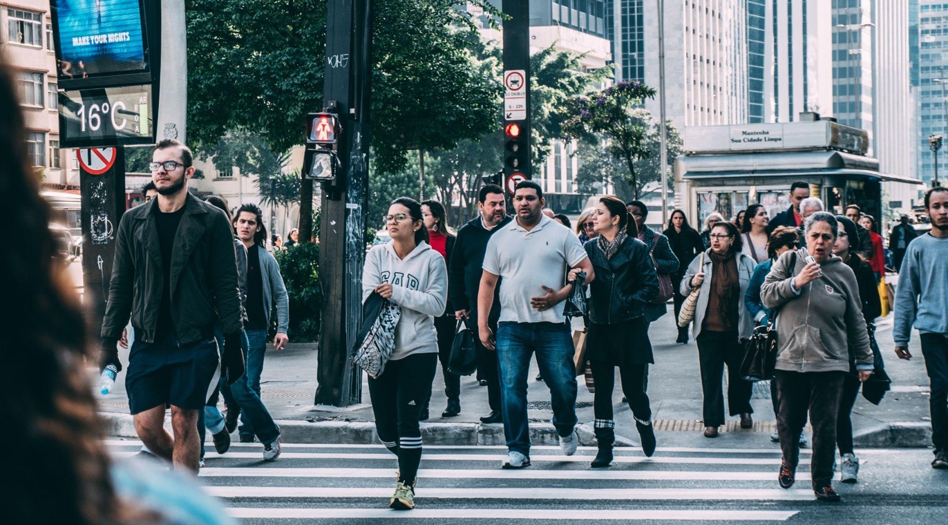 Pedestrians crossing street during the day; image by Kaique Rocha, via Pexels.com.